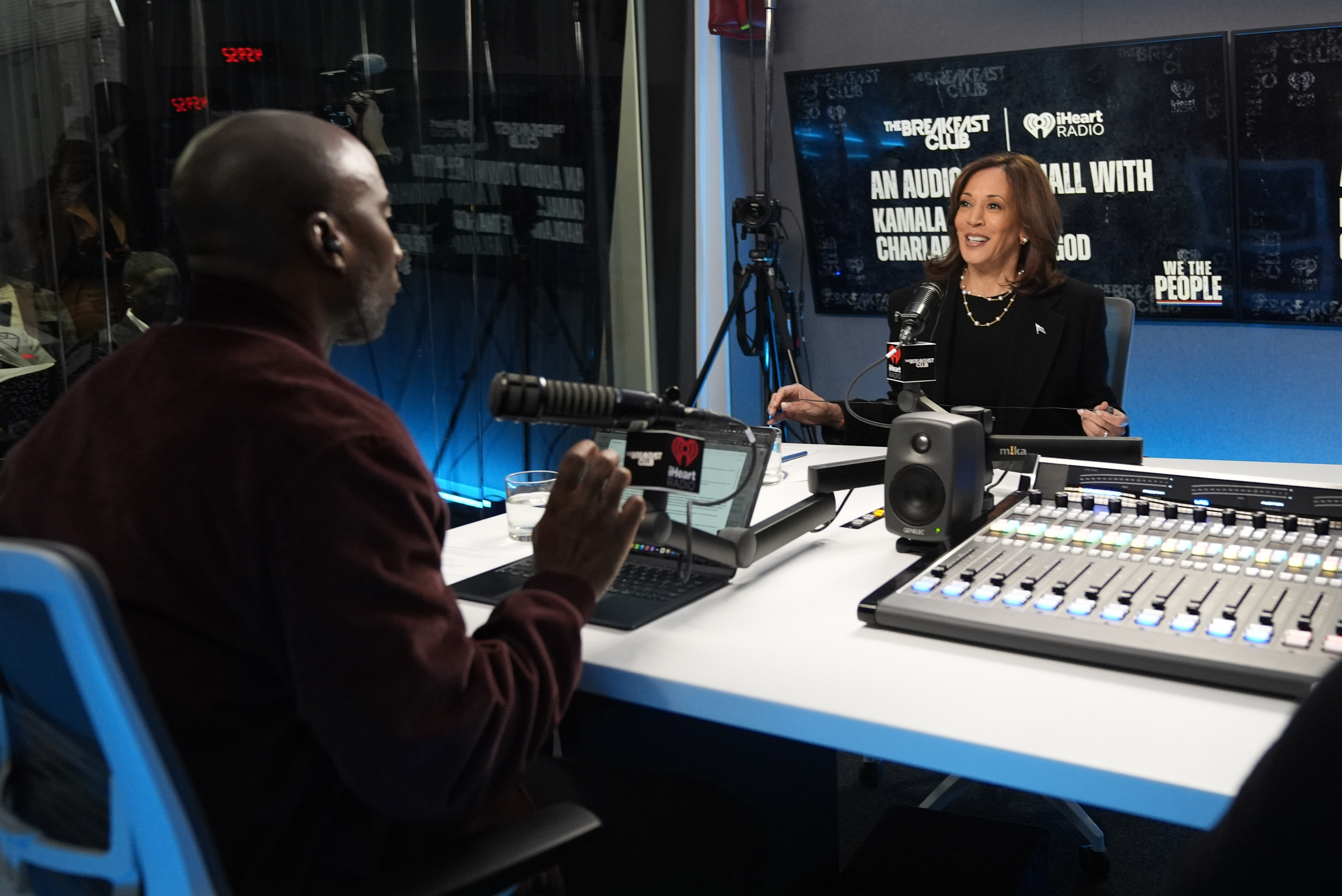 Charlamagne tha God interviews Kamala Harris in a radio studio