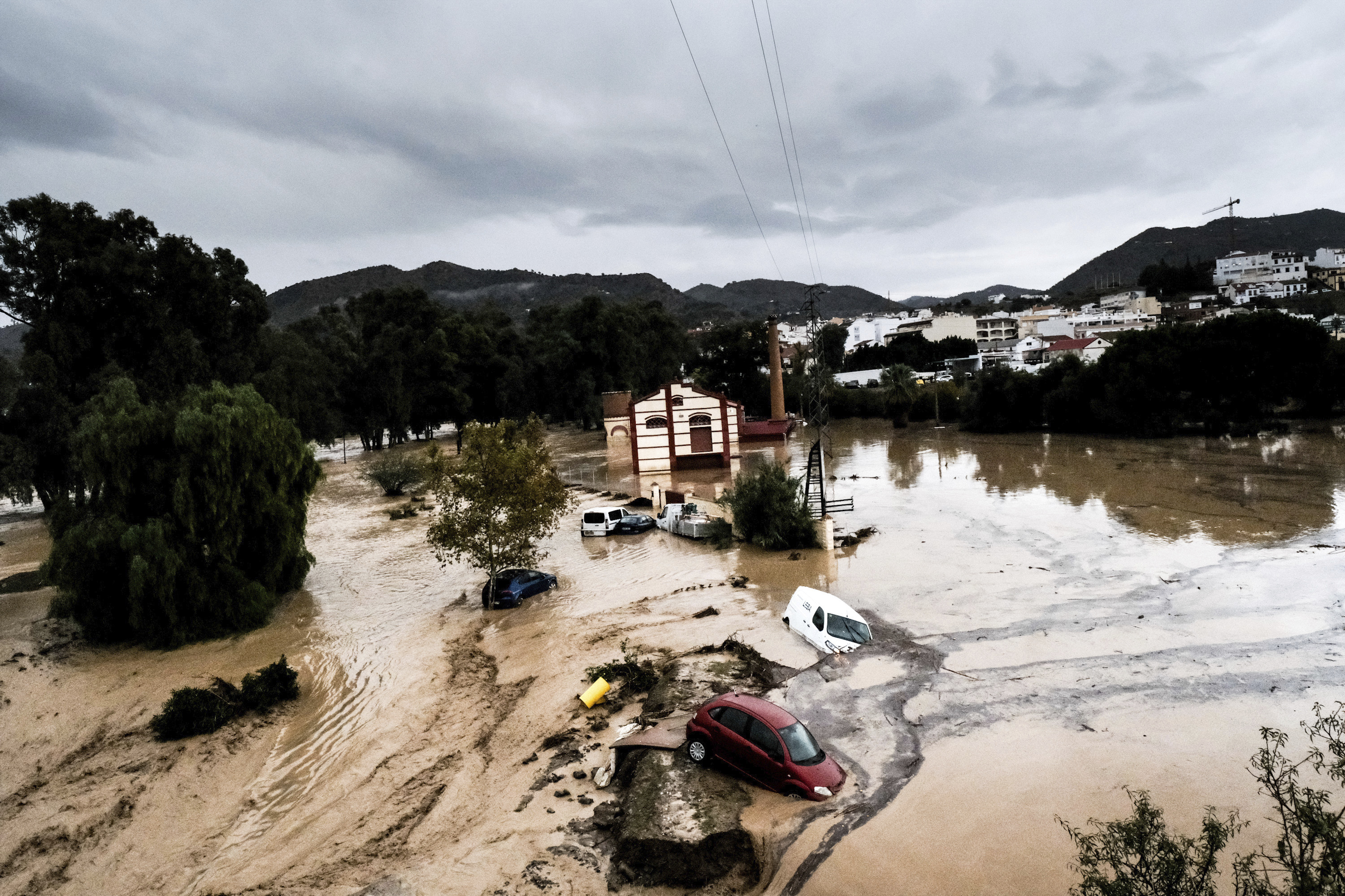 Cars are swept away by water during a flood