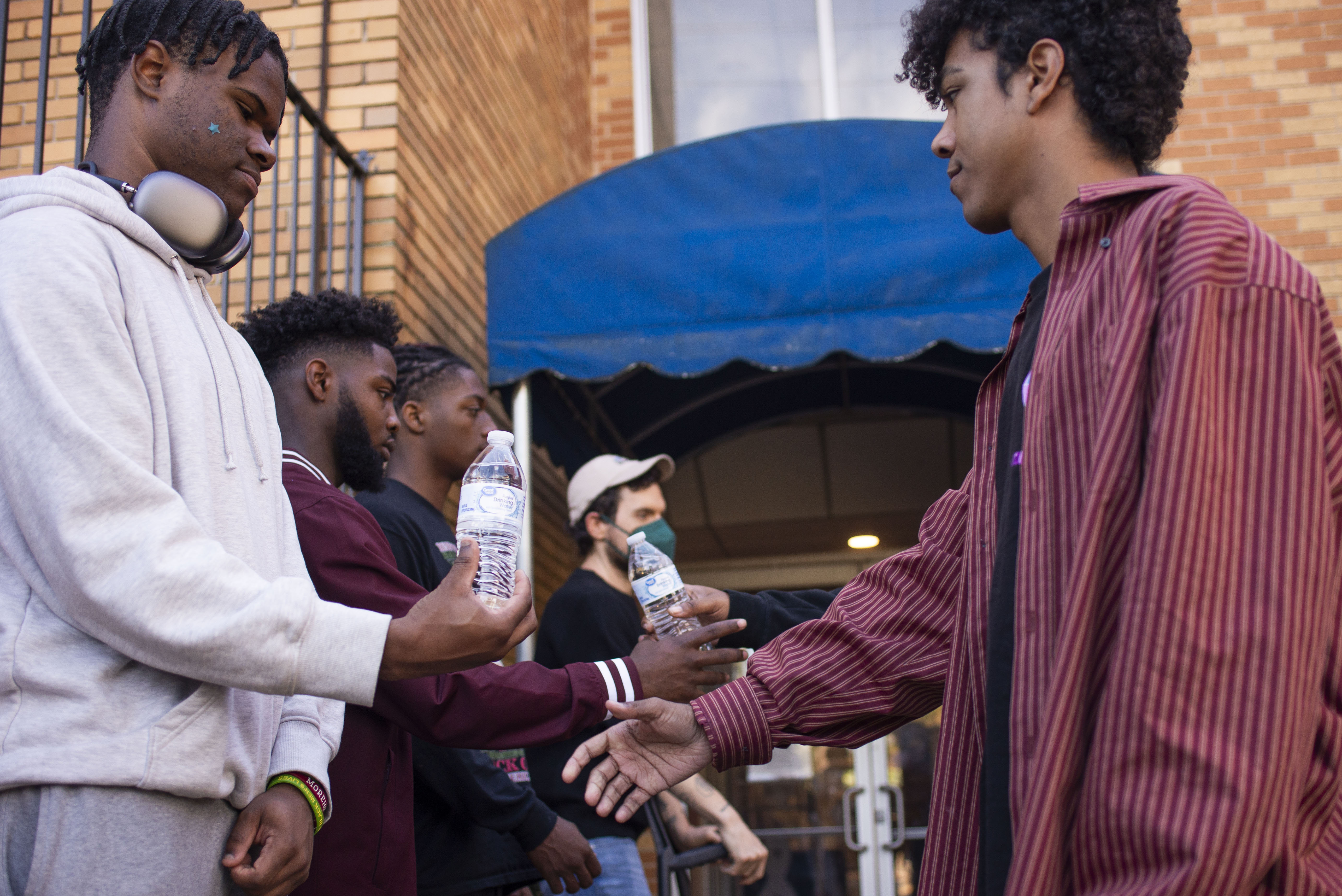 Activists hand water bottles to voters in Atlanta, Georgia