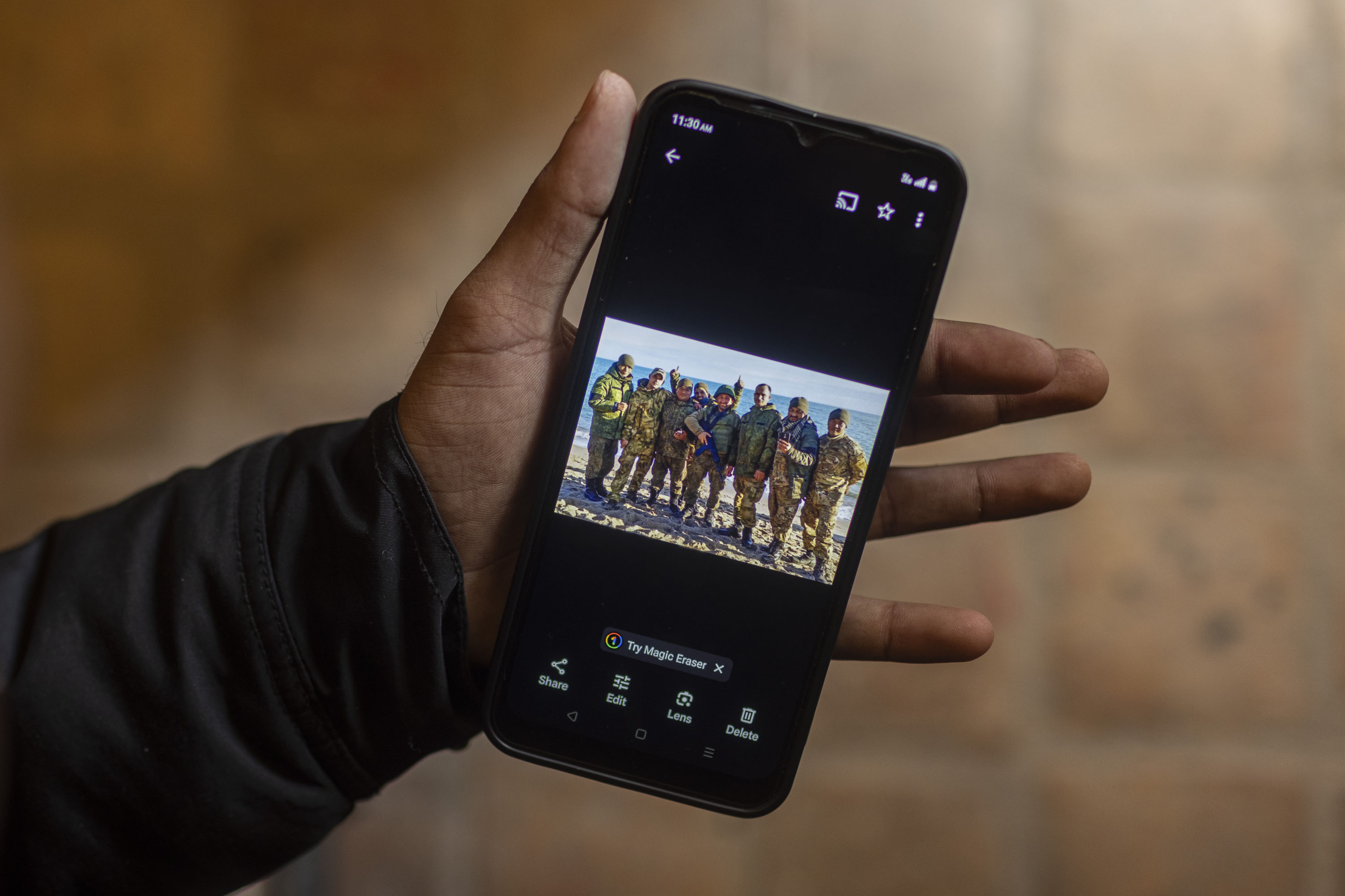 epa11174852 Nepalese returnee Krishna Sharma (named changed), who had joined the Russian military fighting in Ukraine, holds a mobile phone showing a photograph of Nepalese men wearing Russian army uniforms, during an interview in Kathmandu, Nepal, 24 January 2024. (Issued 23 February 2024).Krishna Sharma (named changed), originally from Parbat in west Nepal, worked for two years as a migrant laborer in the Gulf countries. After returning home to Nepal in 2018, he found himself saddled by family debts. Sharma heard that enlisting with the Russian army could help him pay off those debts. A �middleman� told him he would earn 95,000 roubles per month if he joined the Kremlin�s military campaign. He paid a trafficker around 5,300 USD, and within a week had obtained an entry visa. After arriving in Russia, his 27-man unit � all Nepali soldiers save for the Russian commander � were immediately deployed to the Ukraine front. Sharma told EPA that he was lucky to escape with his life on his unit�s first day of battle, in which he was severely wounded in a drone attack. He only survived by pretending to be dead and covering himself with �mud and snow.� After the attack, he told EPA that he spent the night inside a burnt tank. He eventually reached a Wagner Group camp before being transferred to hospital. �There, someone provided substantial assistance, including giving me clothes and helping me contact my family. This kind person also facilitated my visit to the Nepalese embassy, which expedited the issuance of a 24-hour travel document,� Sharma says. Now back in Pokhara, Nepal, he is being treated in hospital to remove grenade fragments still embedded in his chest. Despite the injuries he sustained during his brief but harrowing experience in eastern Ukraine, Sharma is one of the few Nepali recruits lucky enough to make it home. EPA-EFE/NARENDRA SHRESTHA ATTENTION: This Image is part of a PHOTO SET