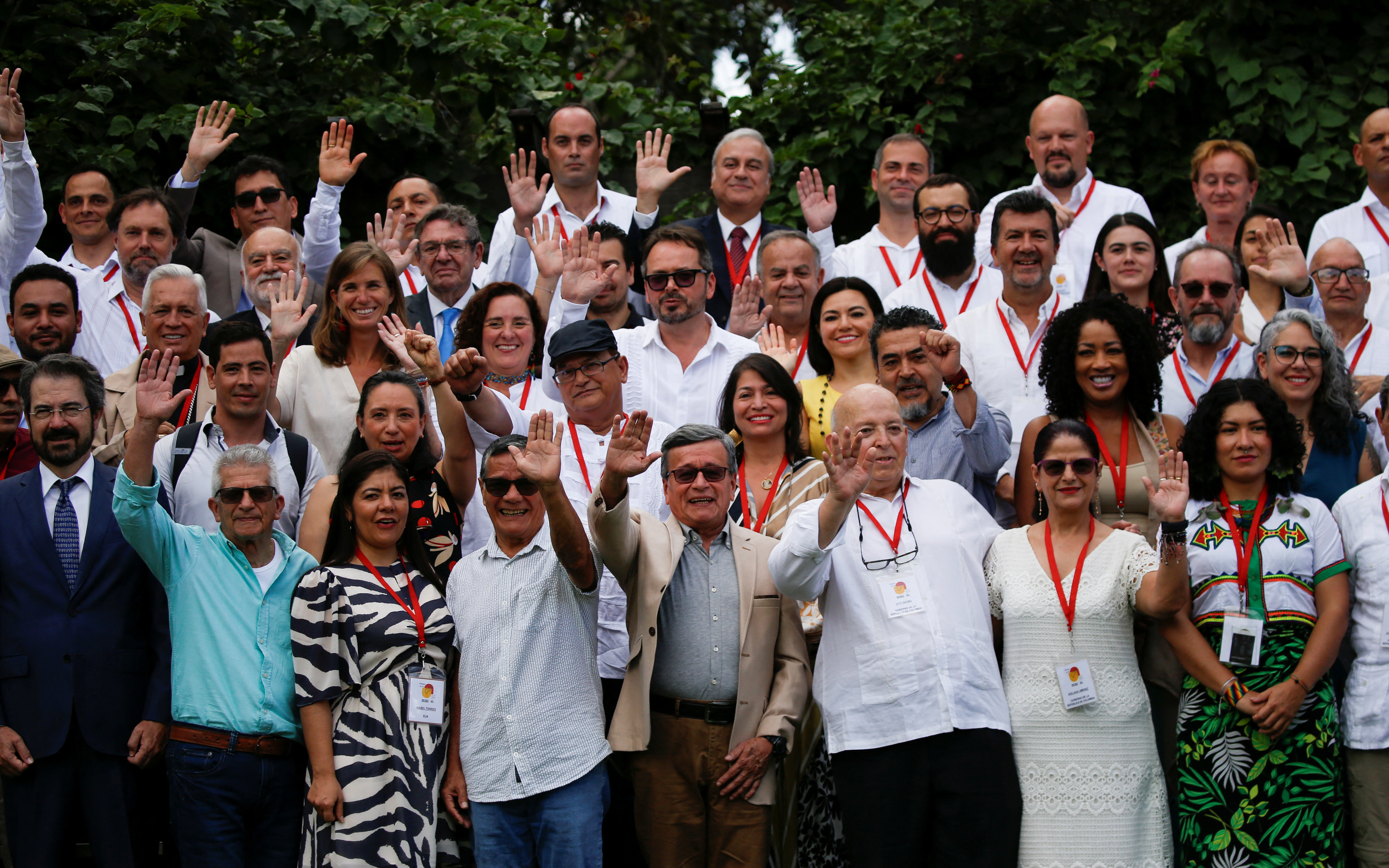 Negotiation teams from the ELN and the Colombian government pose for a picture.