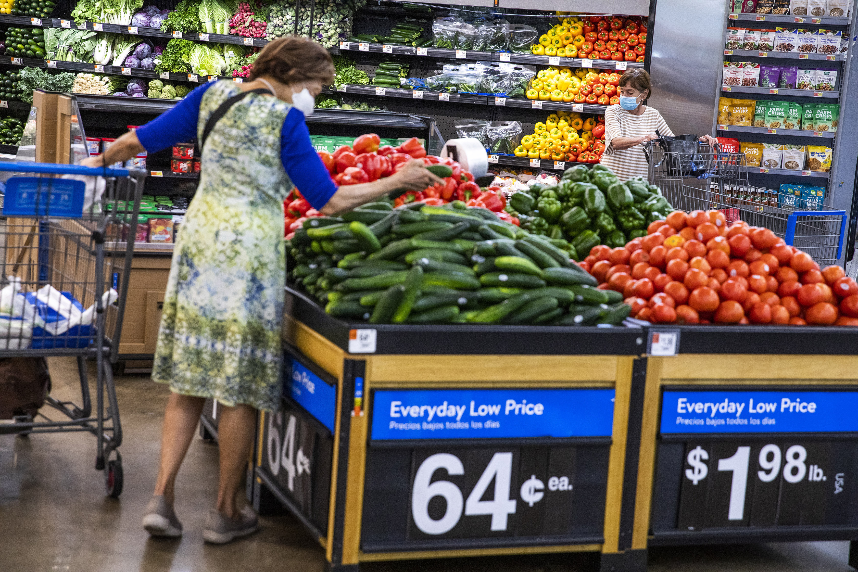 A New Jersey woman shops for produce in a Walmart superstore.