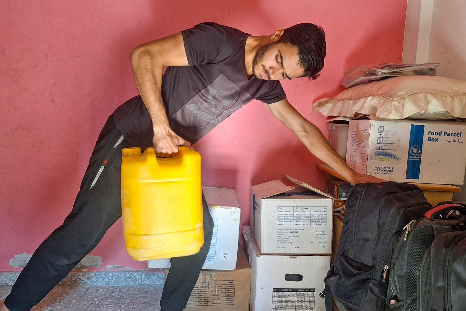 Hatem, when he is unable to find, or reach, a gym in Gaza, improvises by performing traditional weight-bearing exercises using water cannisters, backpacks and bricks