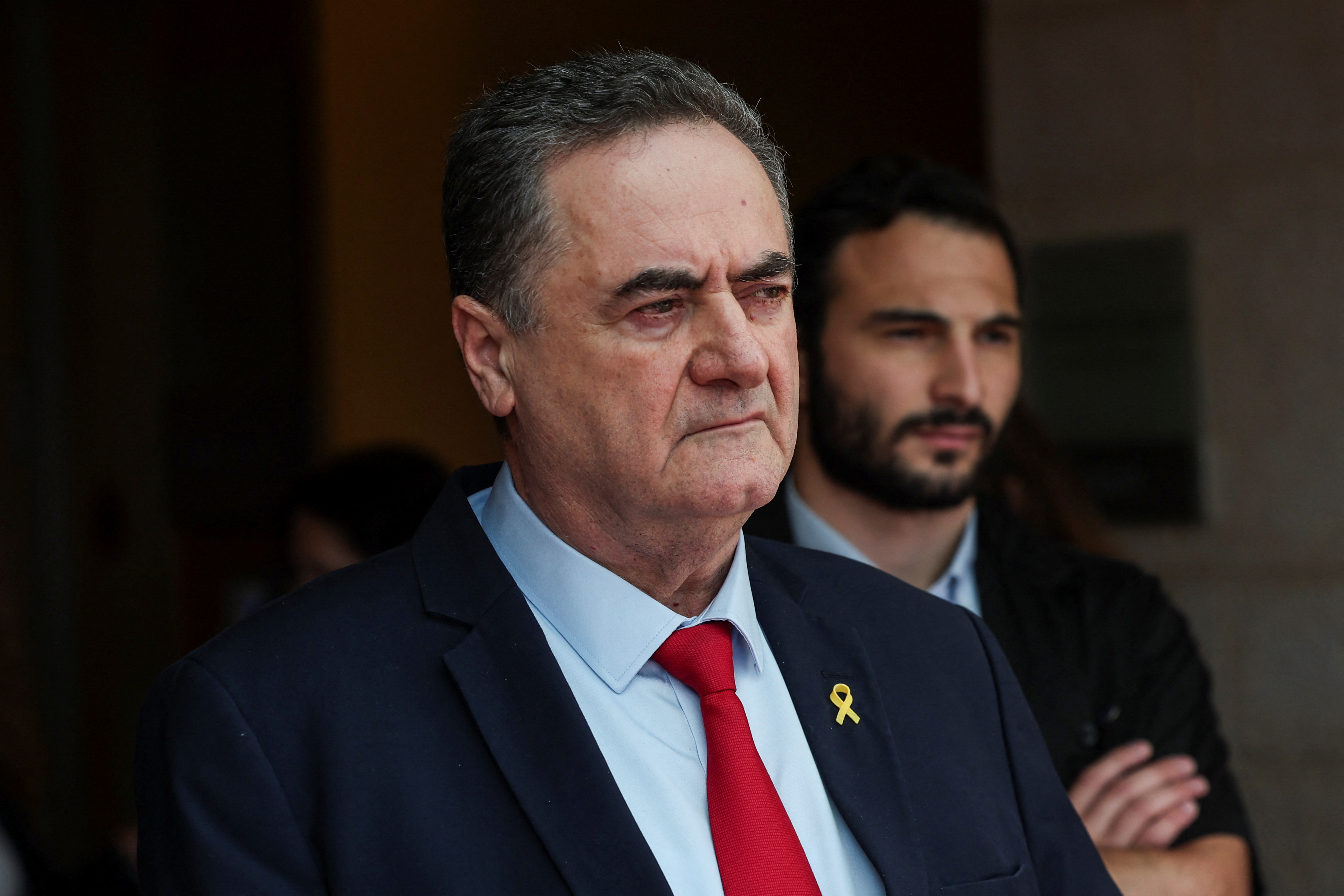 Israeli Foreign Minister Israel Katz looks on