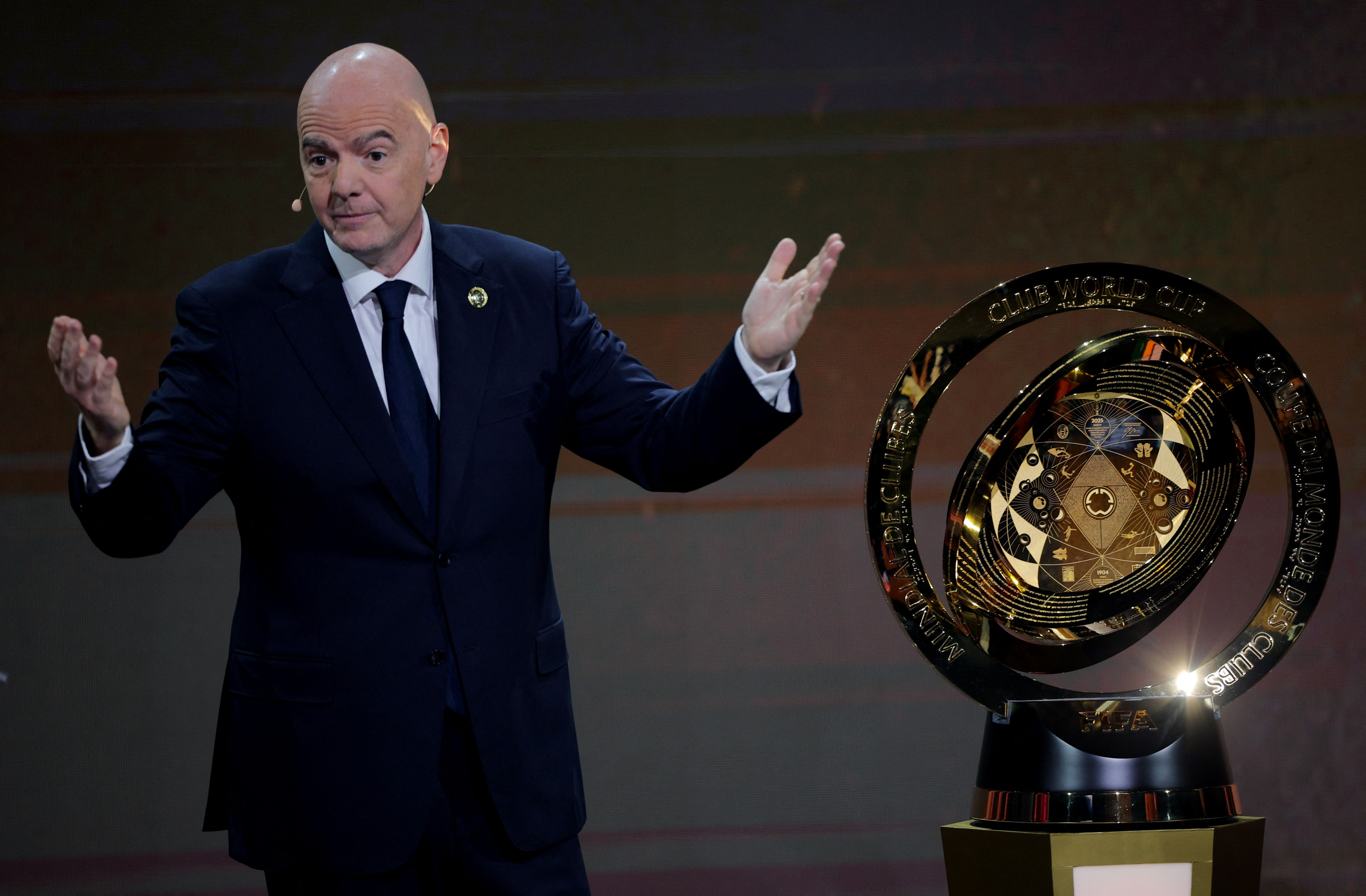 Soccer Football - Club World Cup - Draw - Miami, Florida, United States - December 5, 2024 FIFA president Gianni Infantino with the trophy before the draw REUTERS/Brian Snyder
