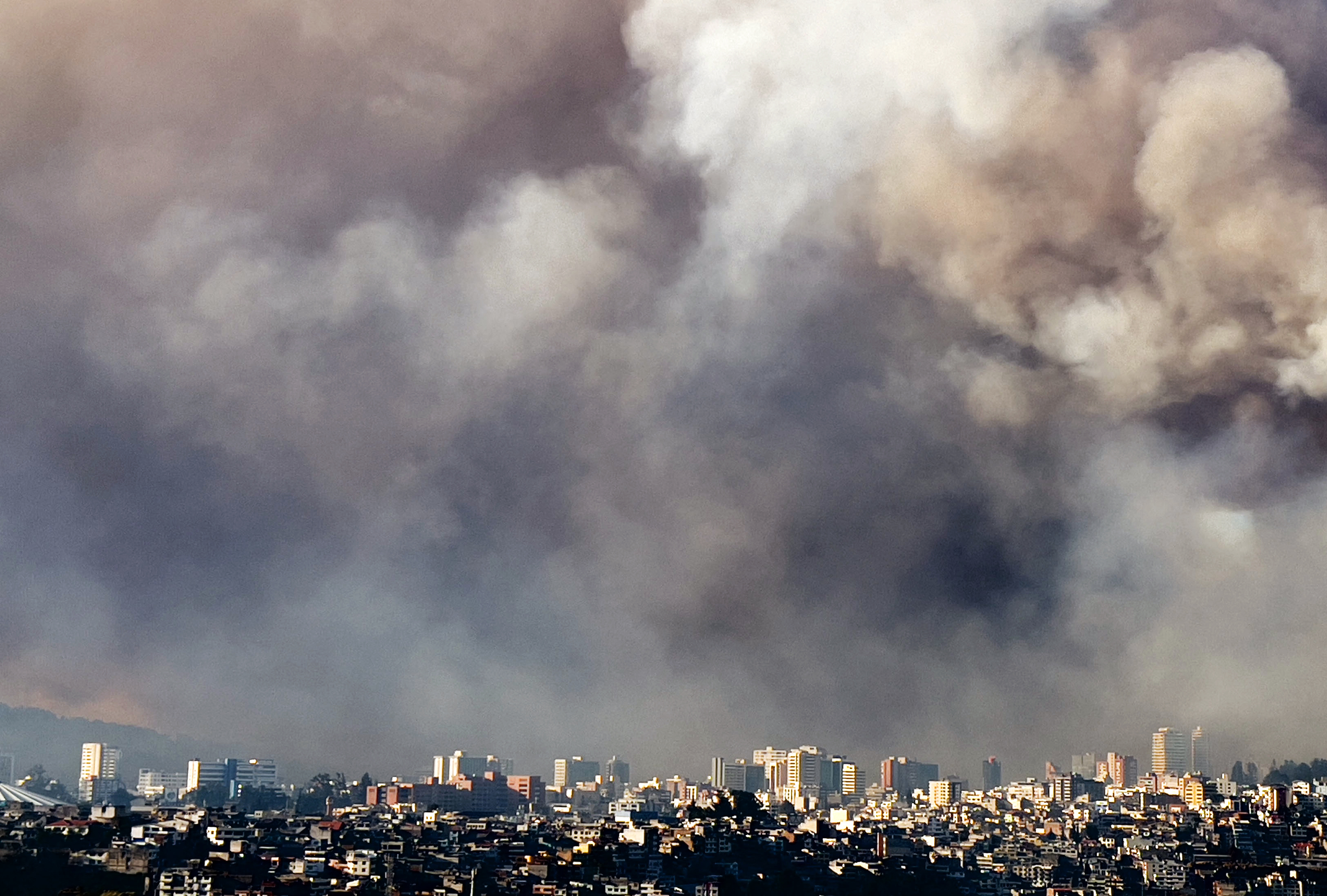 Smoke from a bushfire is pictured over Quito on September 24, 2024