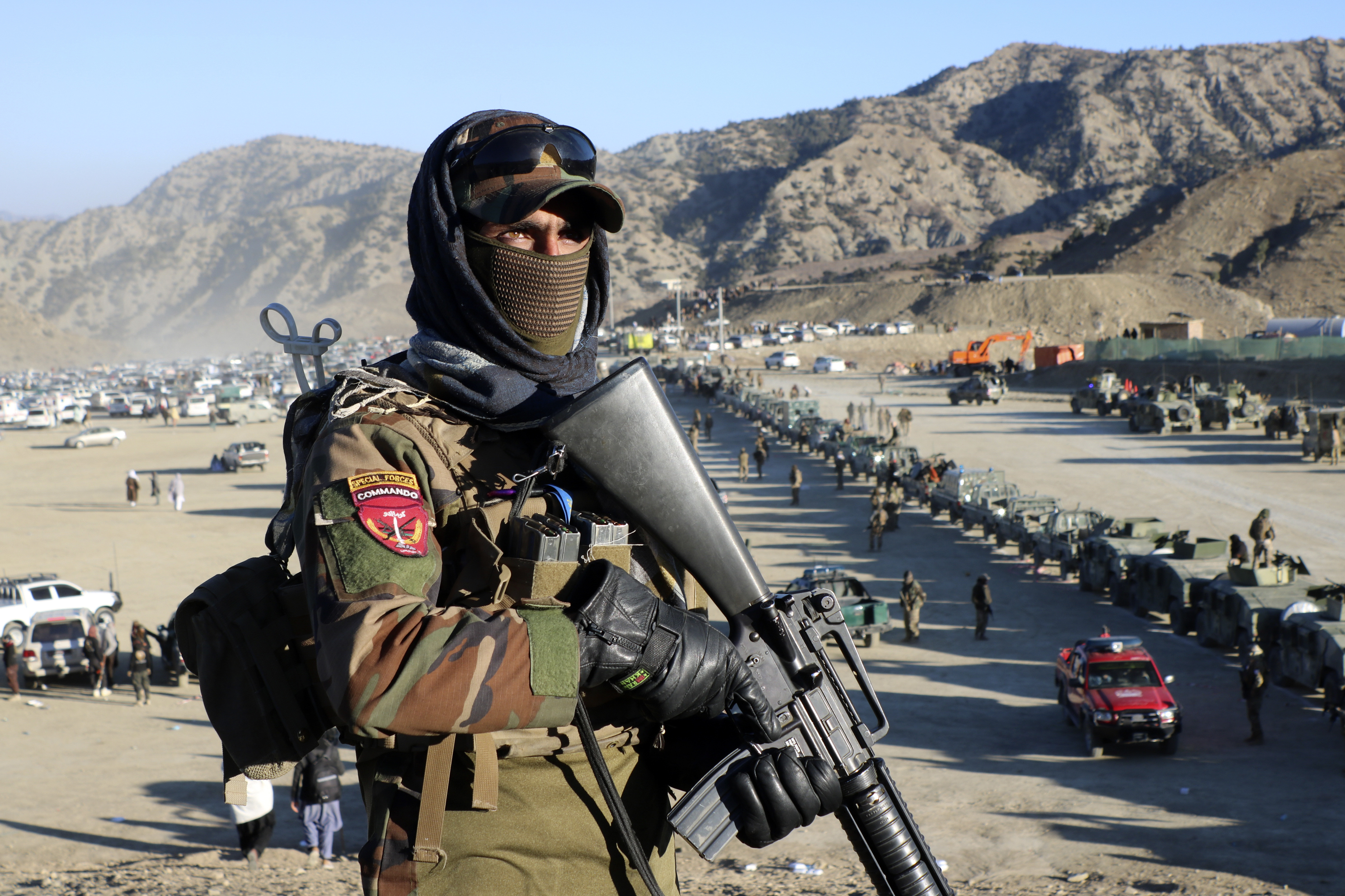 Taliban fighters stand guard