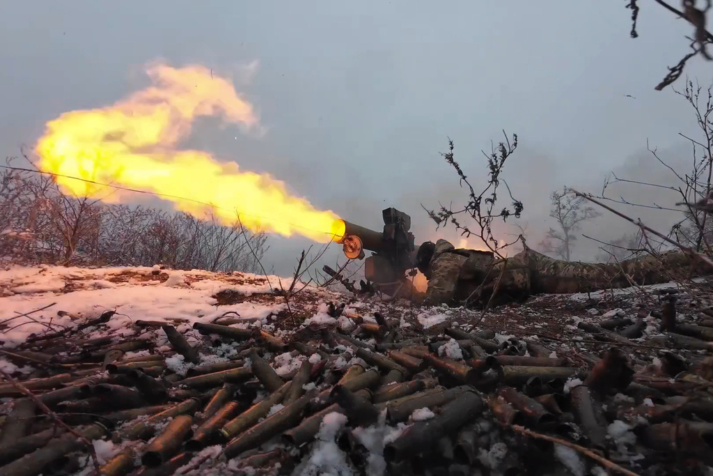 In this photo taken from a video released by Russian Defense Ministry press service on Monday, Dec. 23, 2024, a Russian serviceman fires a 9M113 Konkurs wire-guided anti-tank missile at an undisclosed location. (Russian Defense Ministry Press Service via AP)