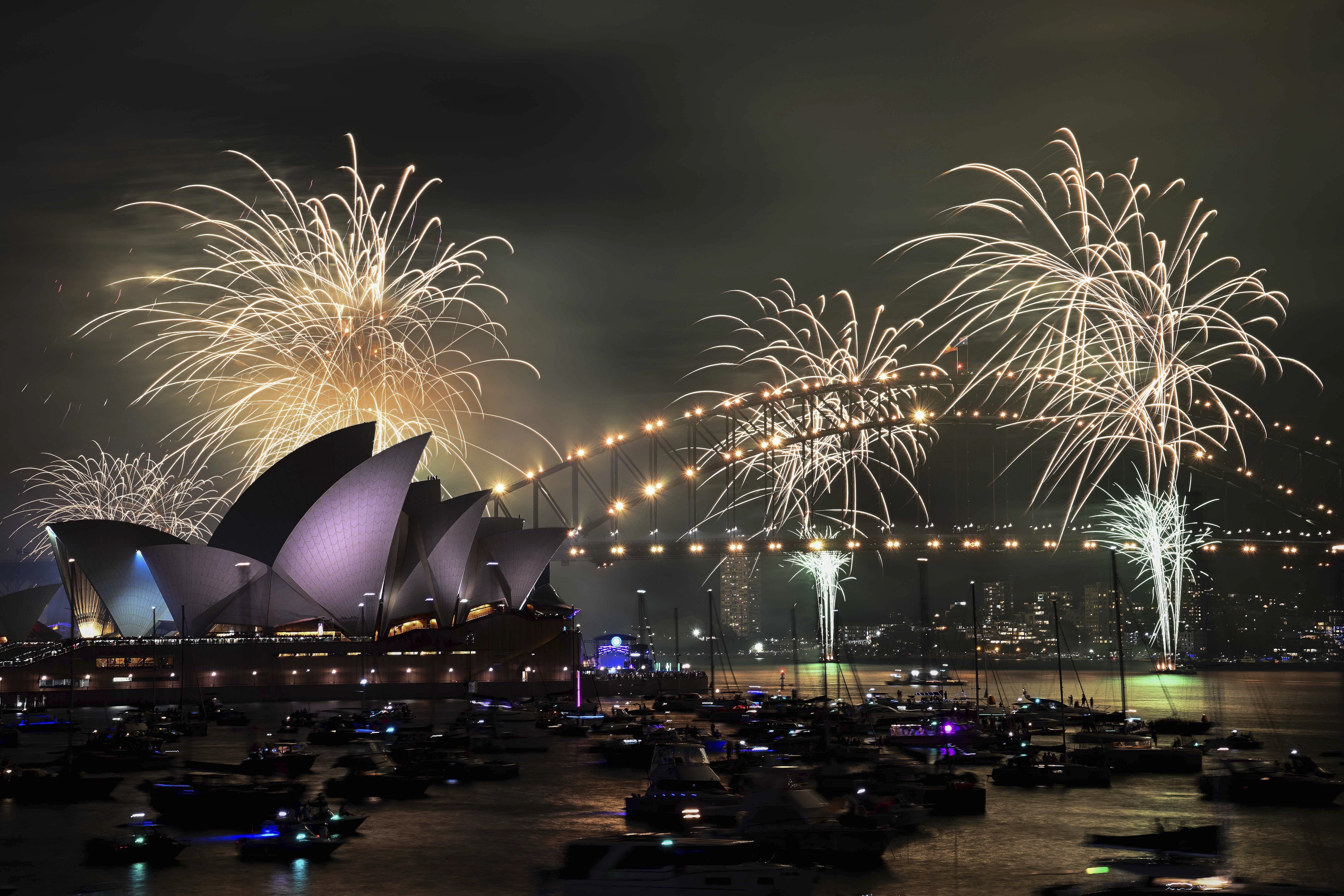 The 9pm fireworks are seen during New Year's Eve celebrations in Sydney, Australia, Tuesday, Dec. 31