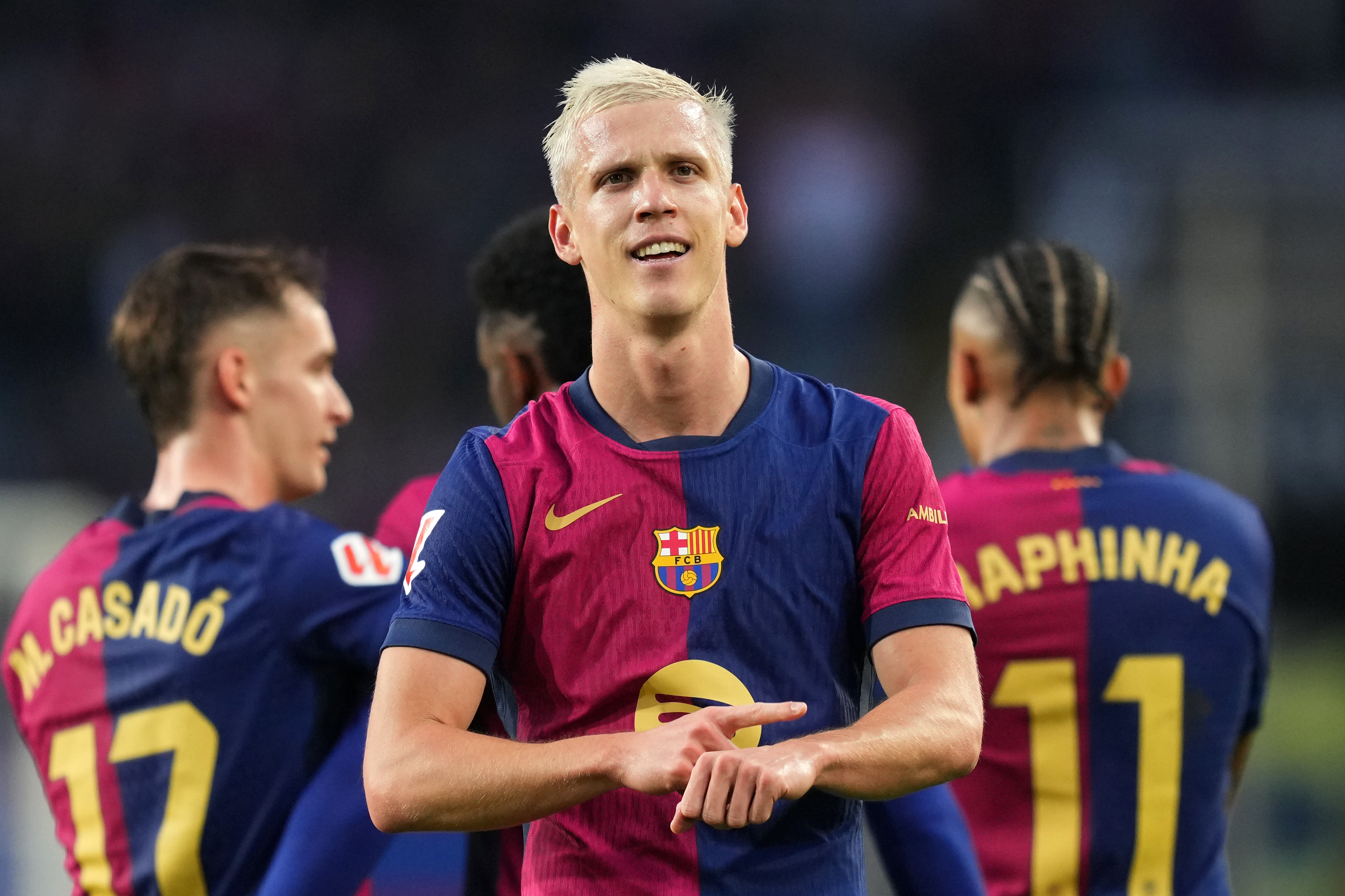 BARCELONA, SPAIN - NOVEMBER 03: Dani Olmo of FC Barcelona celebrates scoring his team's third goal during the La Liga EA Sports match between FC Barcelona and RCD Espanyol at Estadi Olimpic Lluis Companys on November 03, 2024 in Barcelona, Spain. (Photo by Alex Caparros/Getty Images)