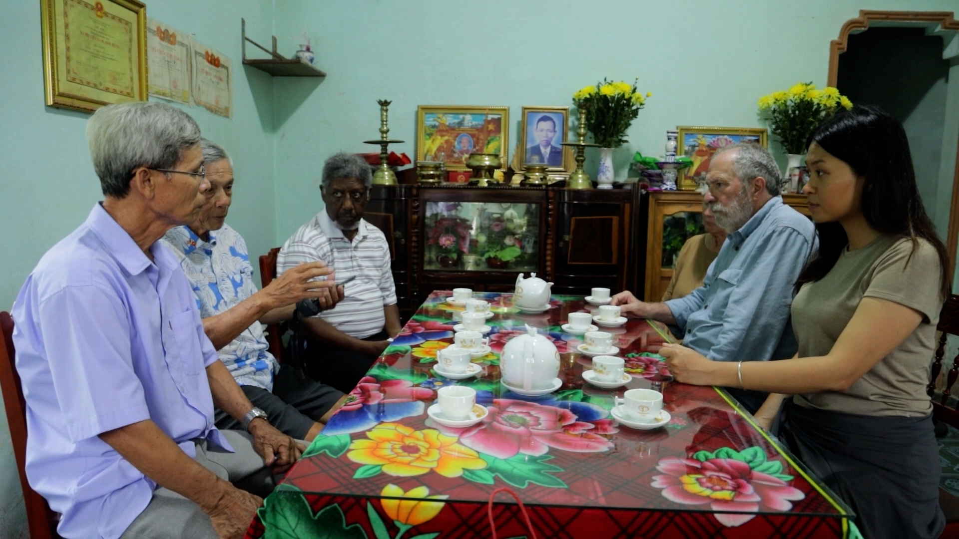 Veterans visiting a Vietnamese family