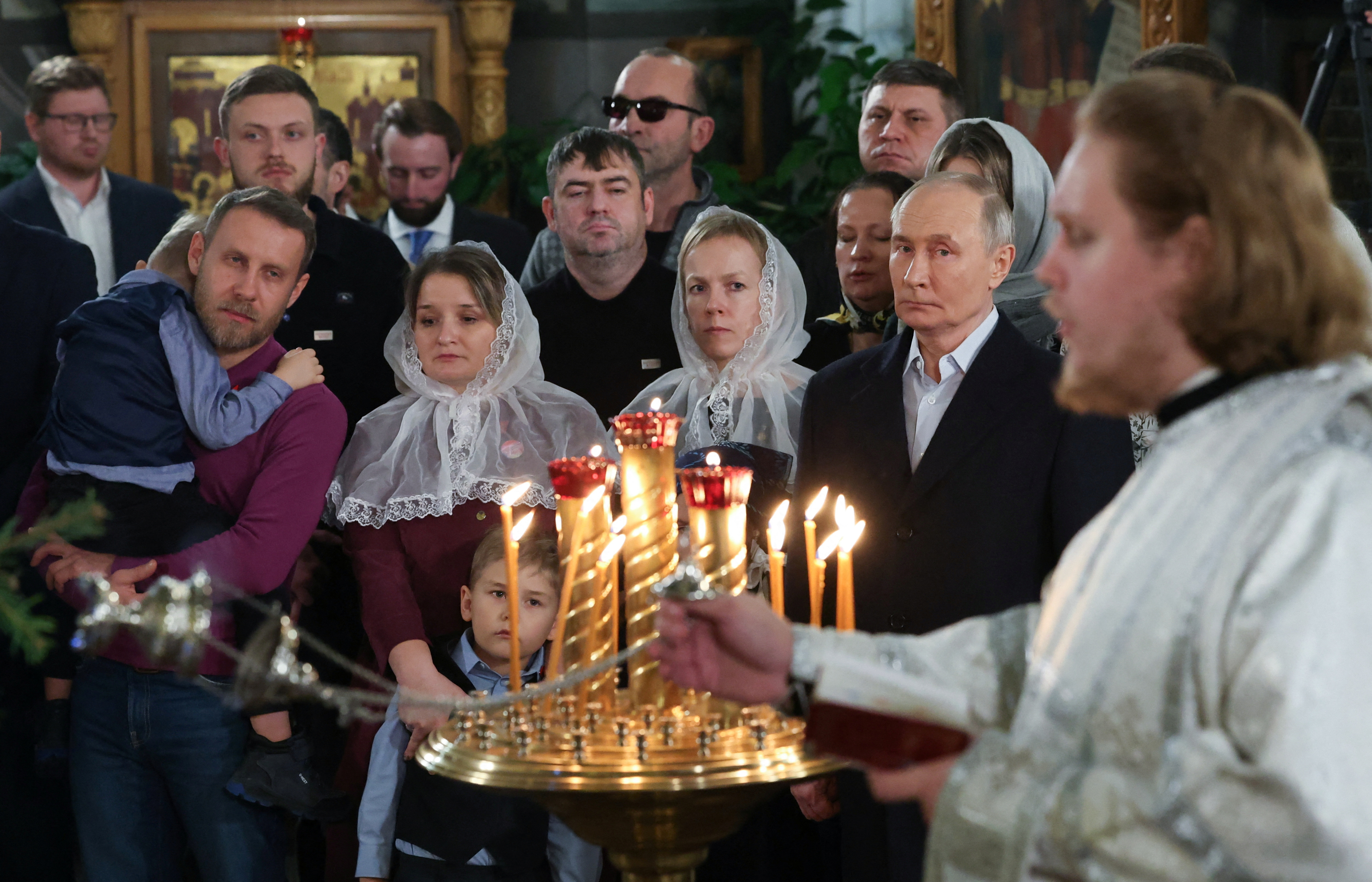 Russia's President Vladimir Putin attends the Orthodox Christmas liturgy at the Church of St. George the Victorious on Poklonnaya Hill in Moscow, Russia January 7, 2025. Sputnik/Vyacheslav Prokofyev/Pool via REUTERS ATTENTION EDITORS - THIS IMAGE WAS PROVIDED BY A THIRD PARTY.