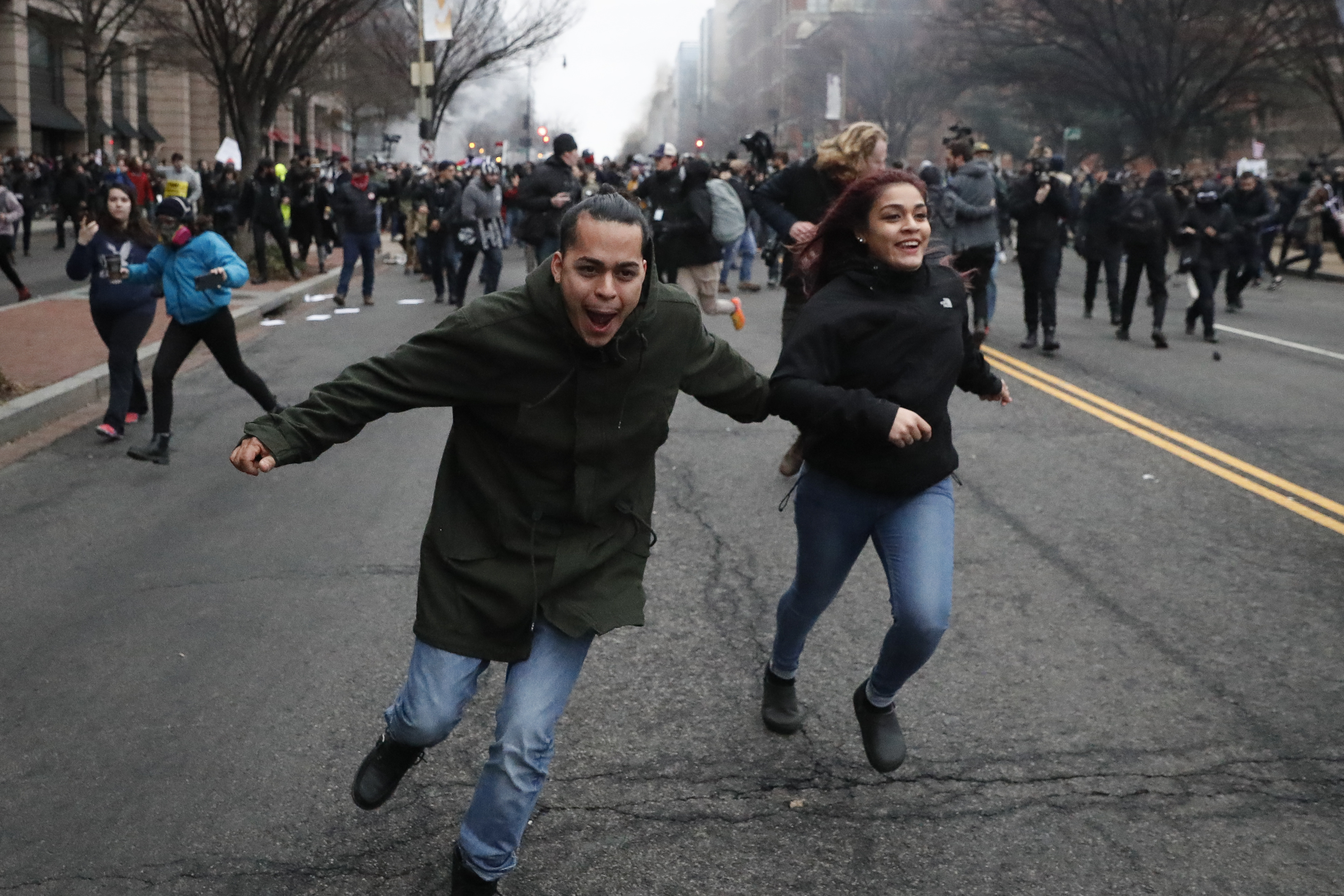 Protesters run through the streets of Washington, DC, in 2017