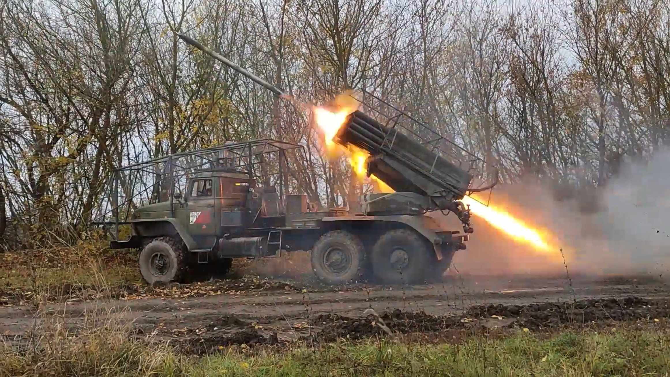 A Russian self-propelled multiple rocket launcher fires towards Ukrainian position in Kursk