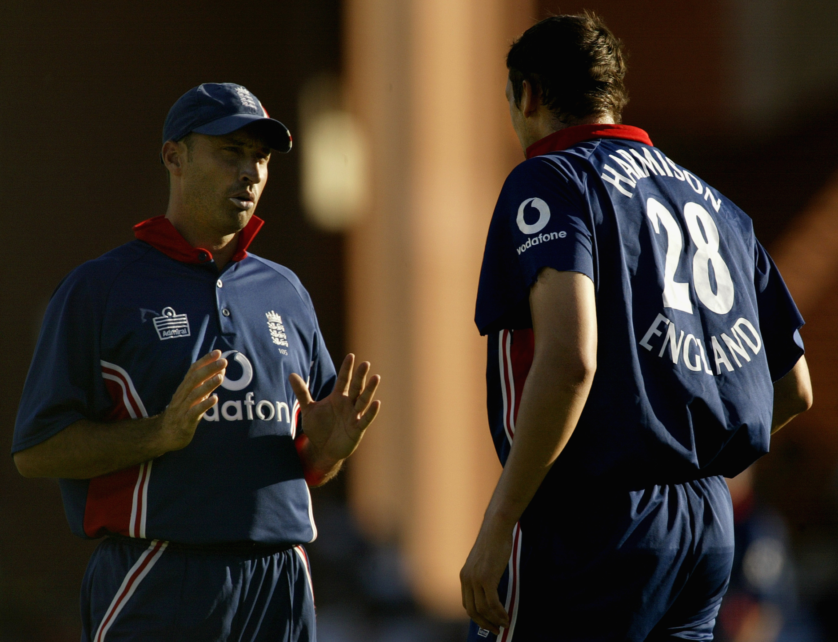 ADELAIDE - JANUARY 17: Nasser Hussain of England chats with team mate Steve Harmison after Harmison went for 27 runs off two overs during the VB series One Day International match between England and Sri Lanka held at Adelaide Oval in Adelaide, Australia on January 17, 2003. (Photo by Hamish Blair/Getty Images)