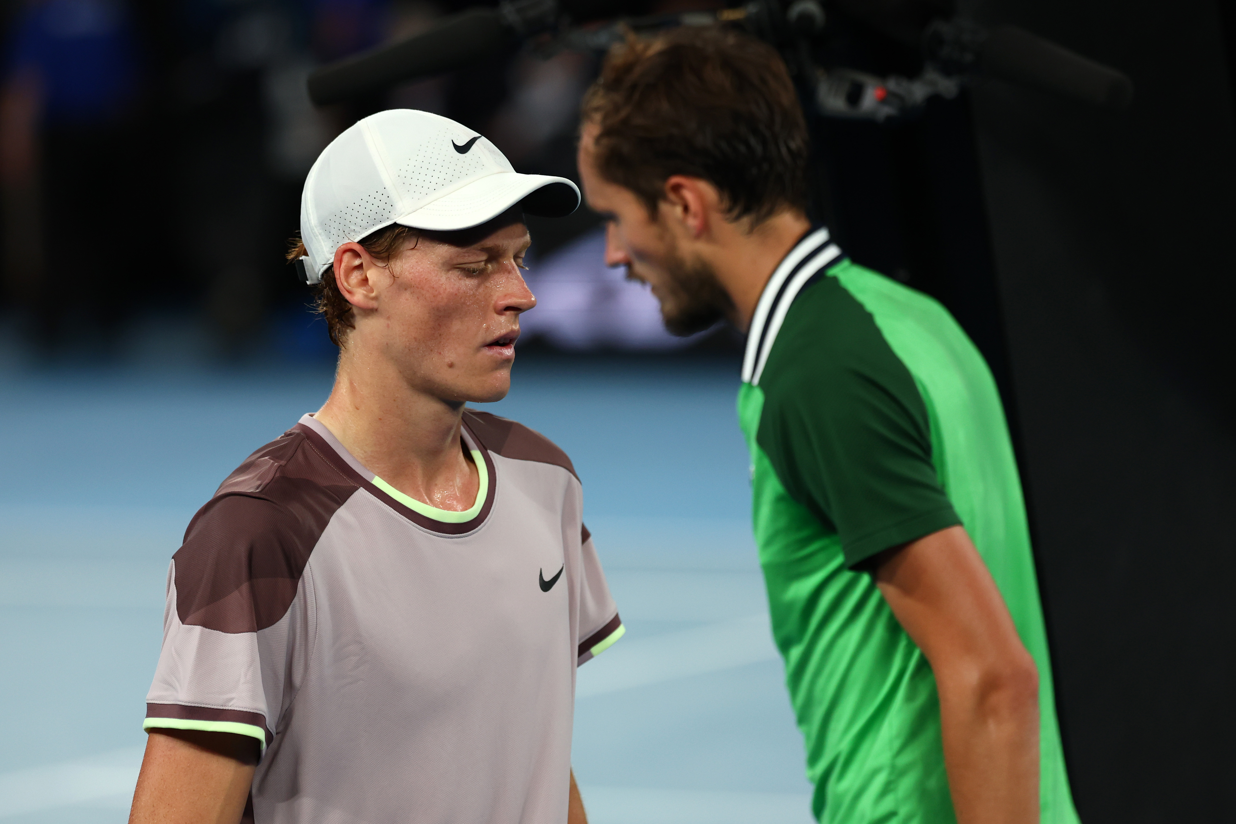 MELBOURNE, AUSTRALIA - JANUARY 28: Jannik Sinner and Daniil Medvedev looks on during their Men's Singles Final match against Daniil Medvedev during the 2024 Australian Open at Melbourne Park on January 28, 2024 in Melbourne, Australia. (Photo by Graham Denholm/Getty Images)