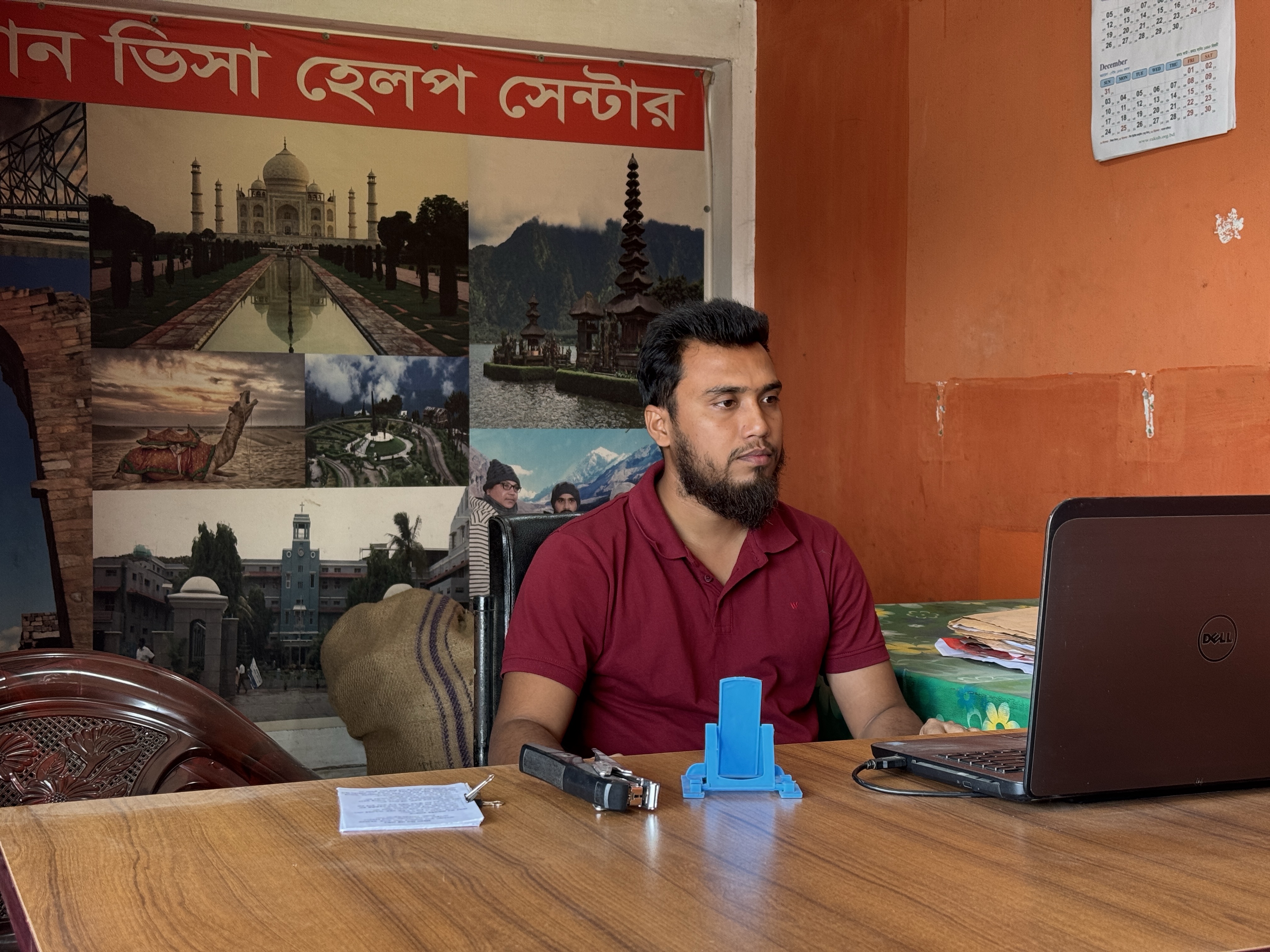 Ridowan Hossain, who runs a visa support agency in Joypurhat, Bangladesh, has been struggling to secure appointments for his clients [Moudud Ahmmed Sujan/Al Jazeera]