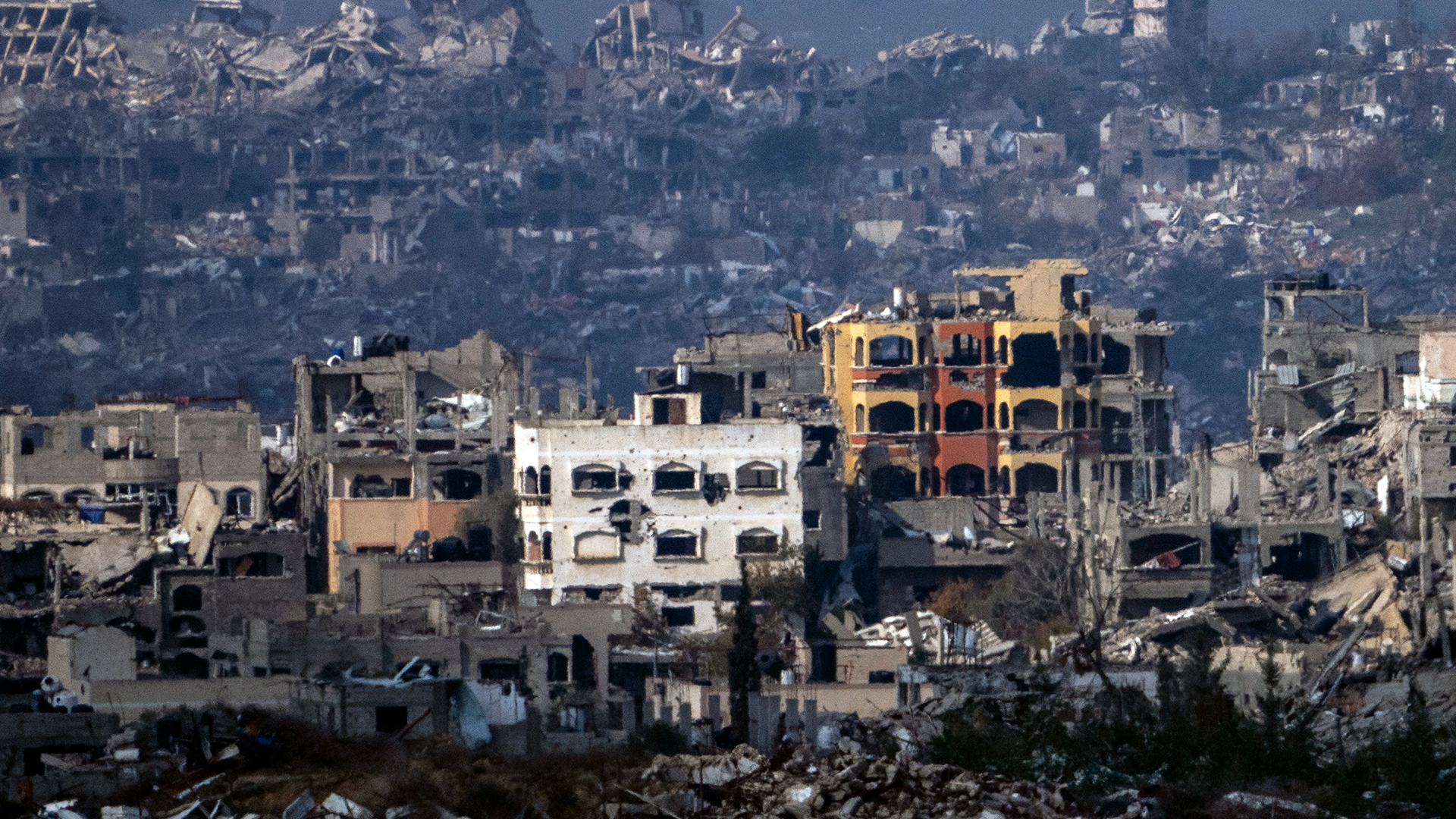 Destroyed buildings by Israeli bombardments as seen inside the Gaza Strip from southern Israel, Thursday, Jan. 16, 2025 (AP Photo/Ariel Schalit) (AP Photo)