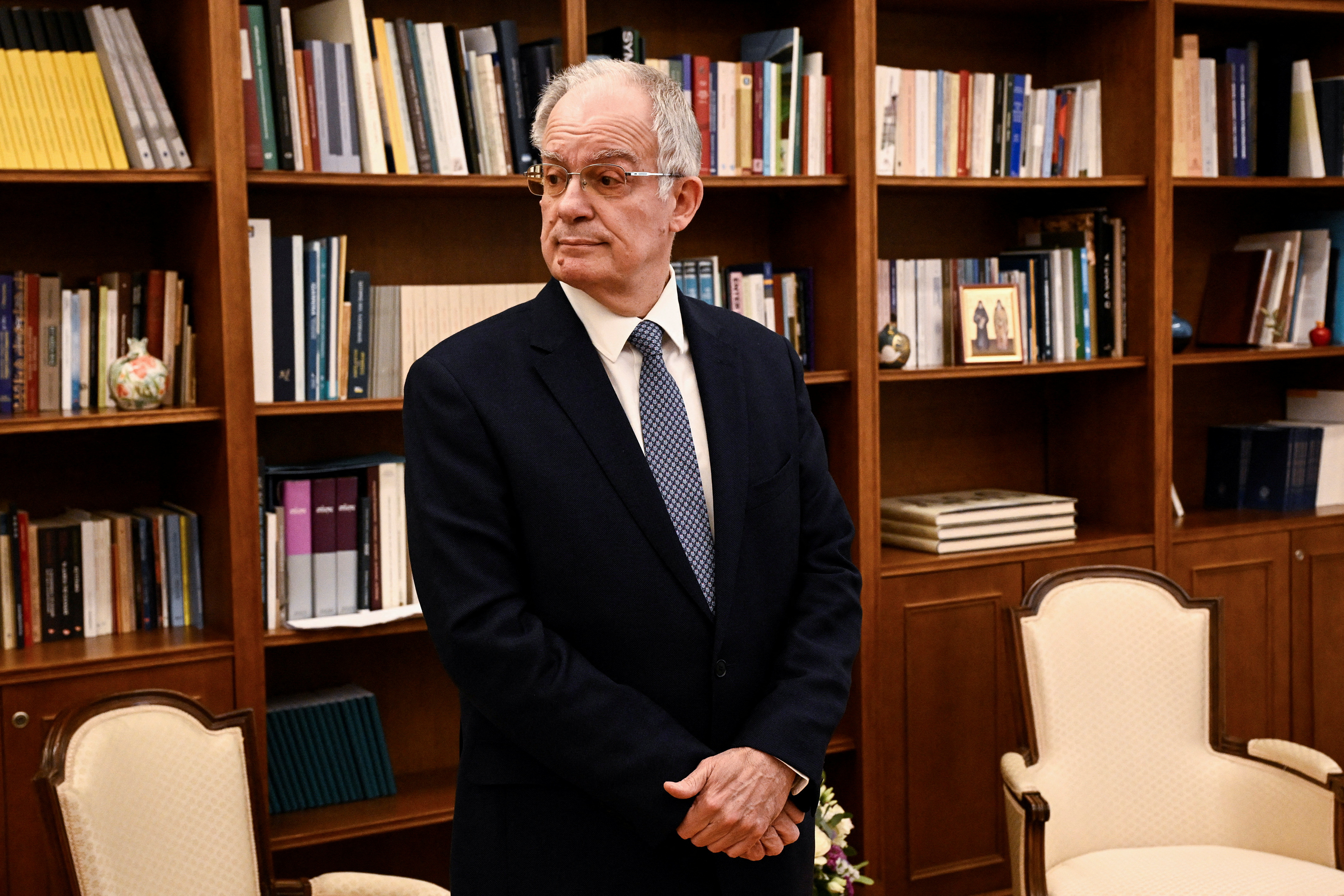 Newly elected Greek President Constantine Tassoulas waits to receive the results of the fourth round of voting in the parliament building in Athens