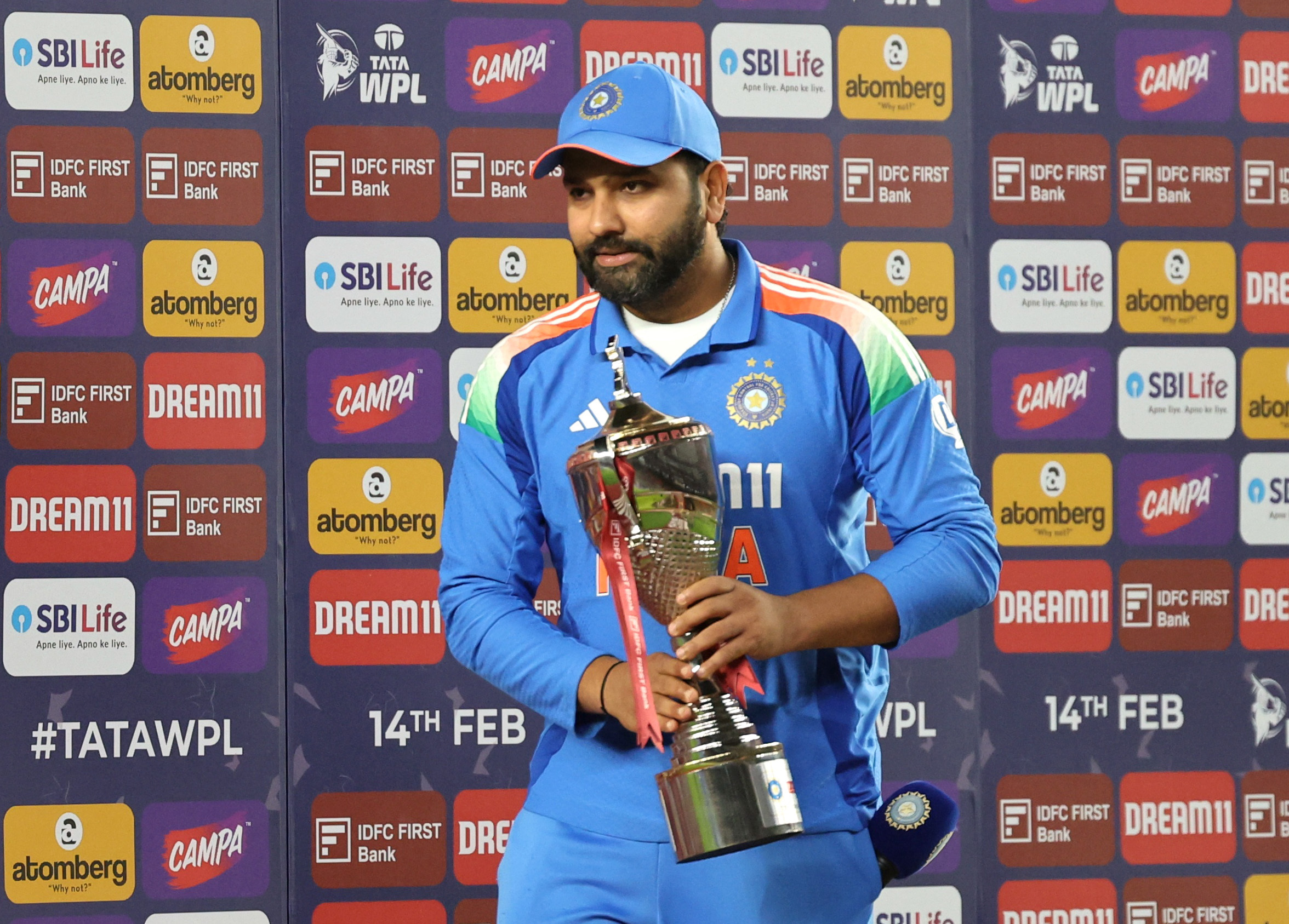Cricket - Second One Day International - India v England - Narendra Modi Stadium, Ahmedabad, India - February 12, 2025 India's Rohit Sharma holds the trophy during the post match presentation after winning the One Day International series REUTERS/Amit Dave