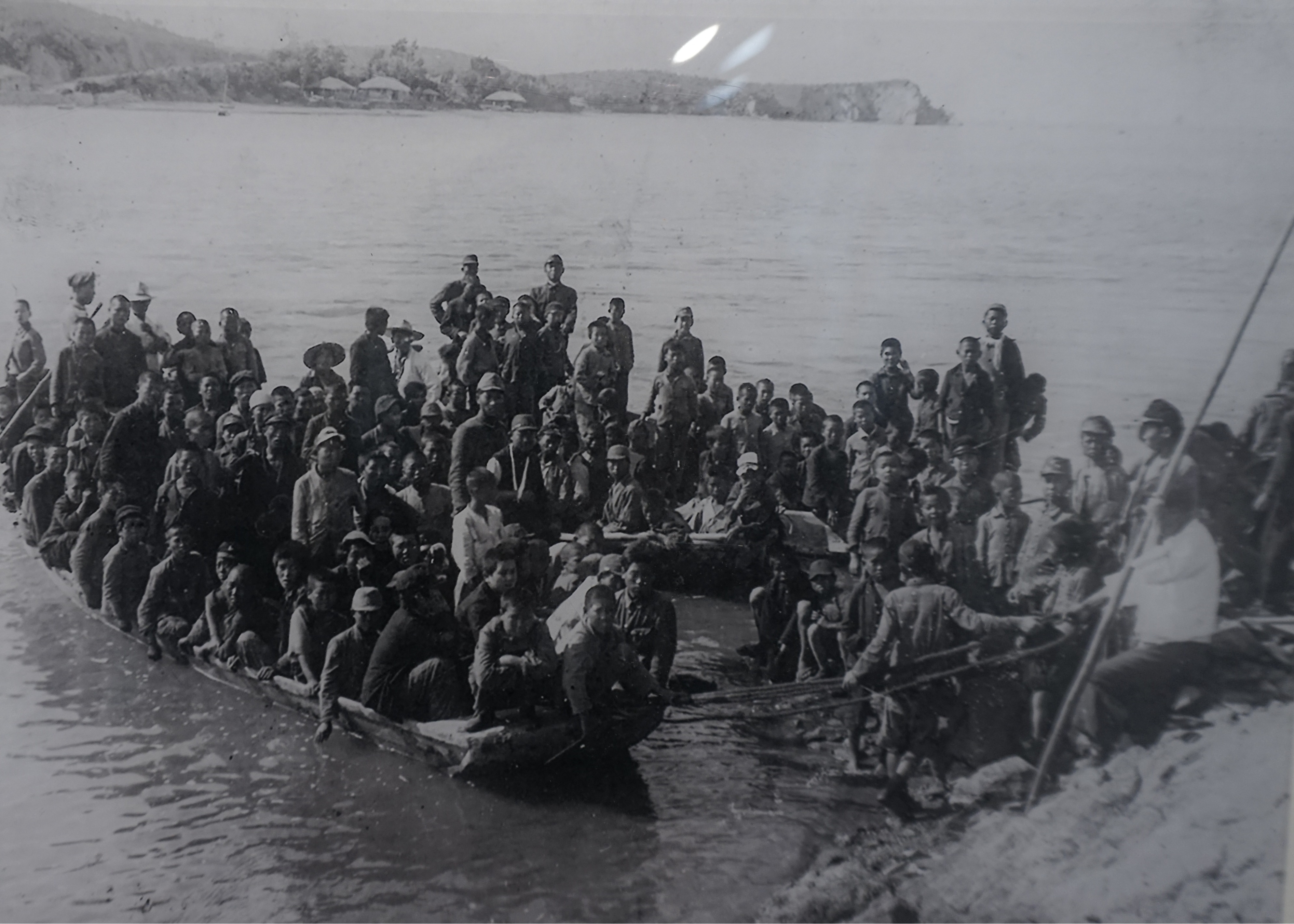 A photo of an image showing young inmates arriving by boat on Seon-gam Island