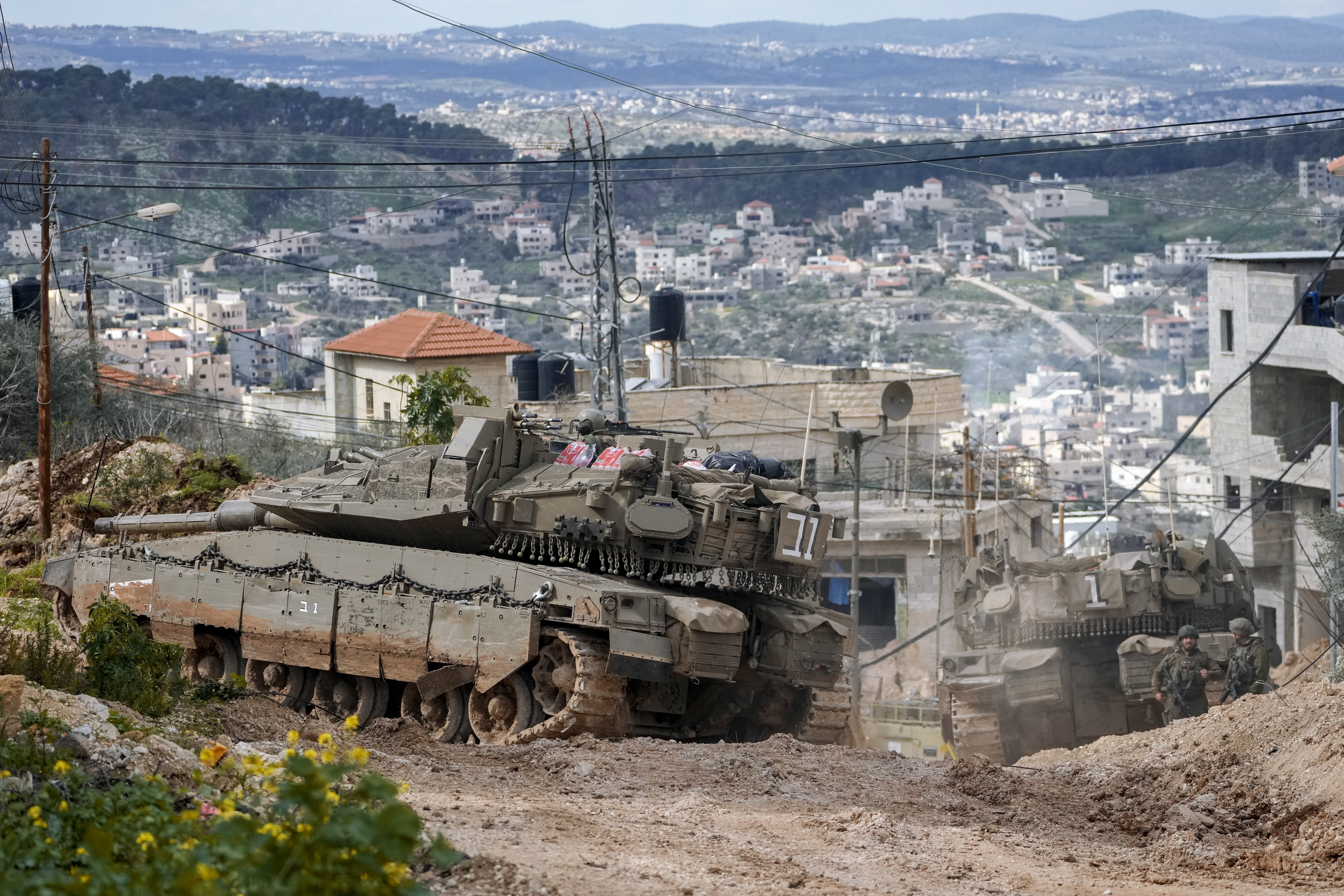 Israeli tanks are deployed during an ongoing army operation in the West Bank Jenin refugee camp,