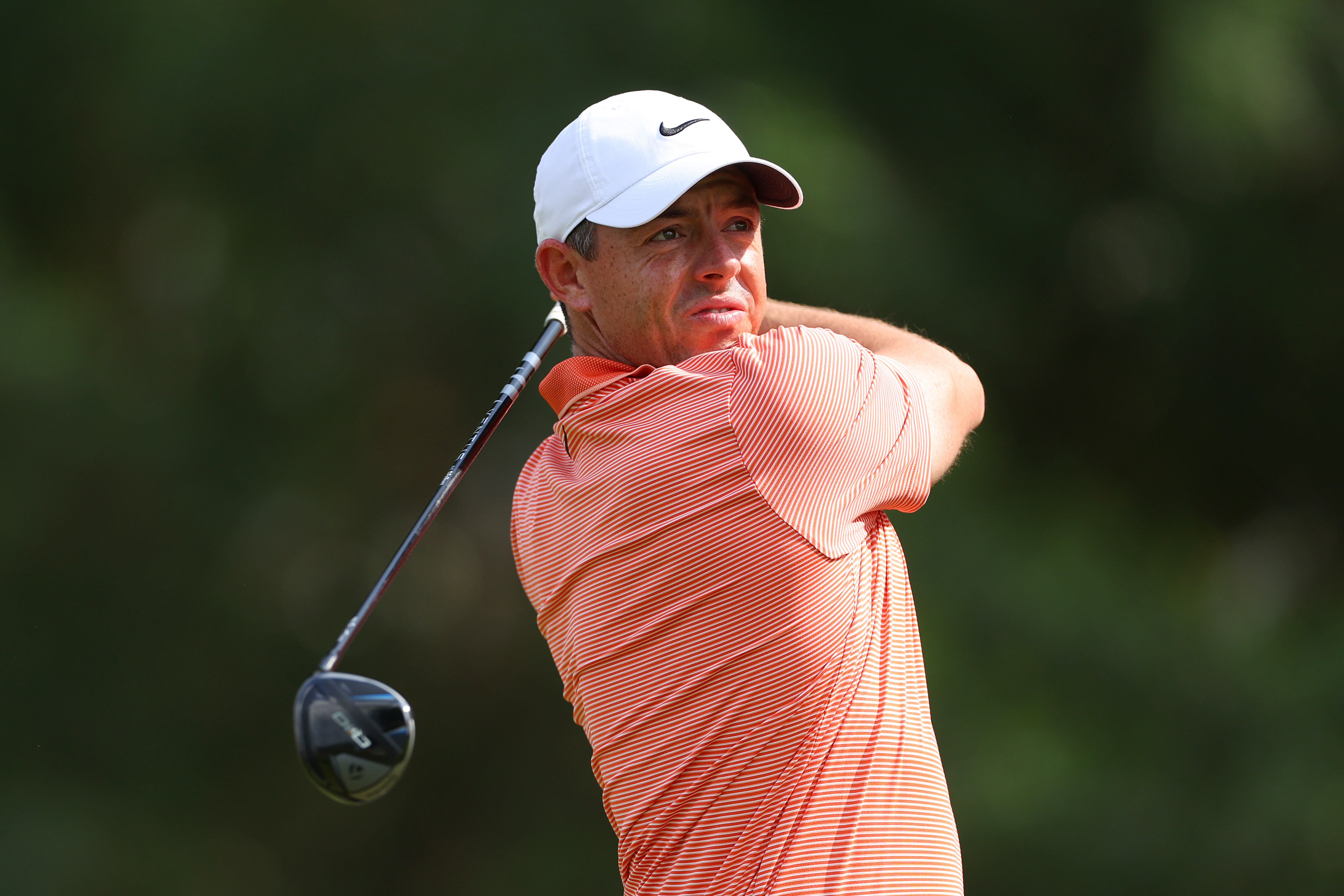DUBAI, UNITED ARAB EMIRATES - JANUARY 19: Rory McIlroy of Northern Ireland tees off on the fifth hole on day four of the Hero Dubai Desert Classic at Emirates Golf Club on January 19, 2025 in Dubai, United Arab Emirates. (Photo by Andrew Redington/Getty Images)