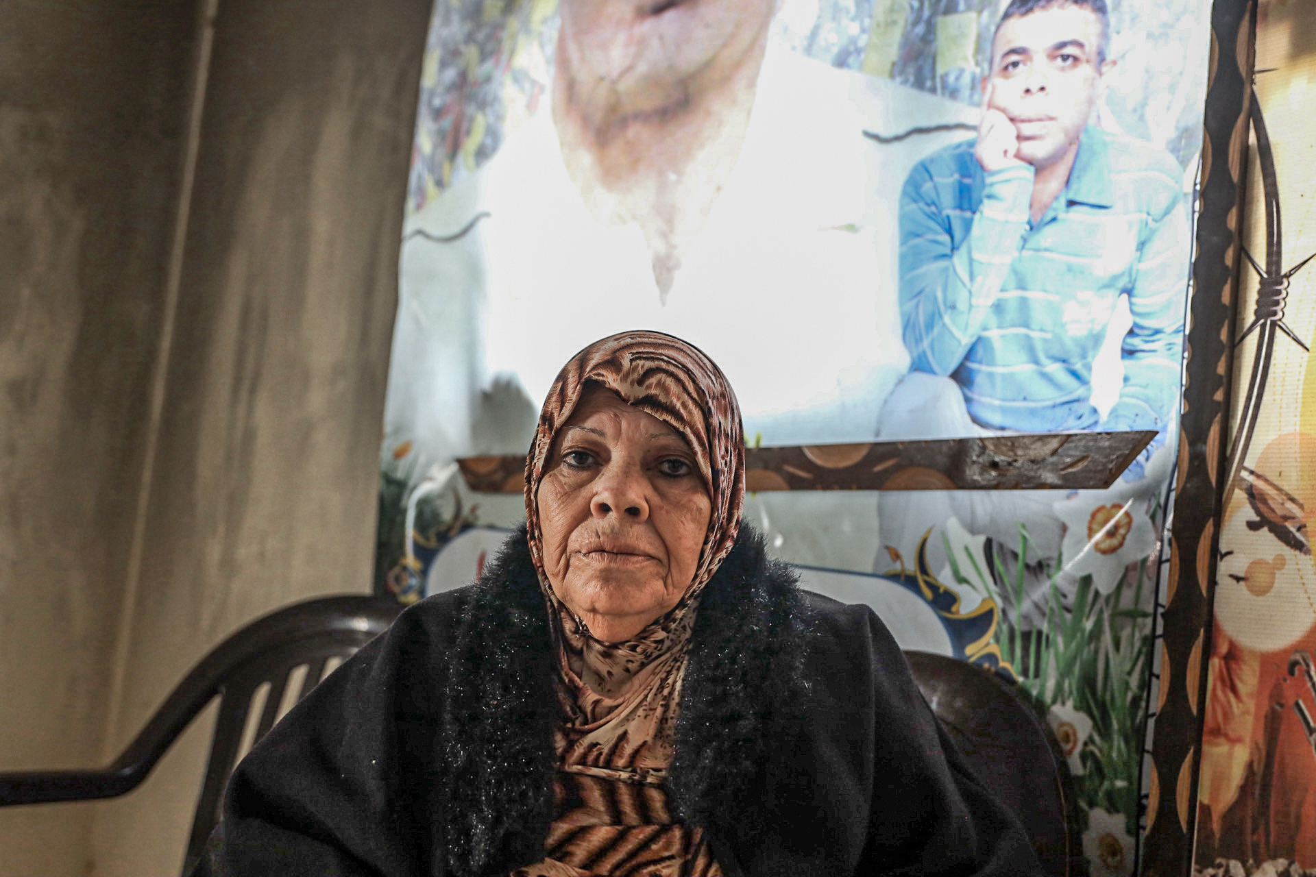 Najat Al-Agha sits in her badly damaged home in Khan Younis.
