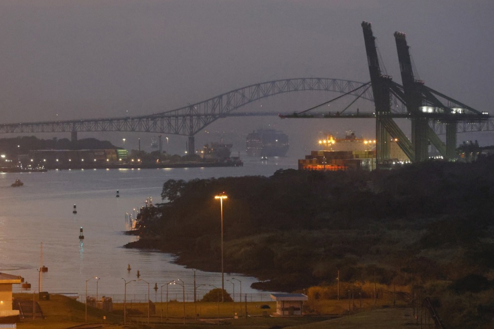 Ships transit by the entrance at the Panama Canal.