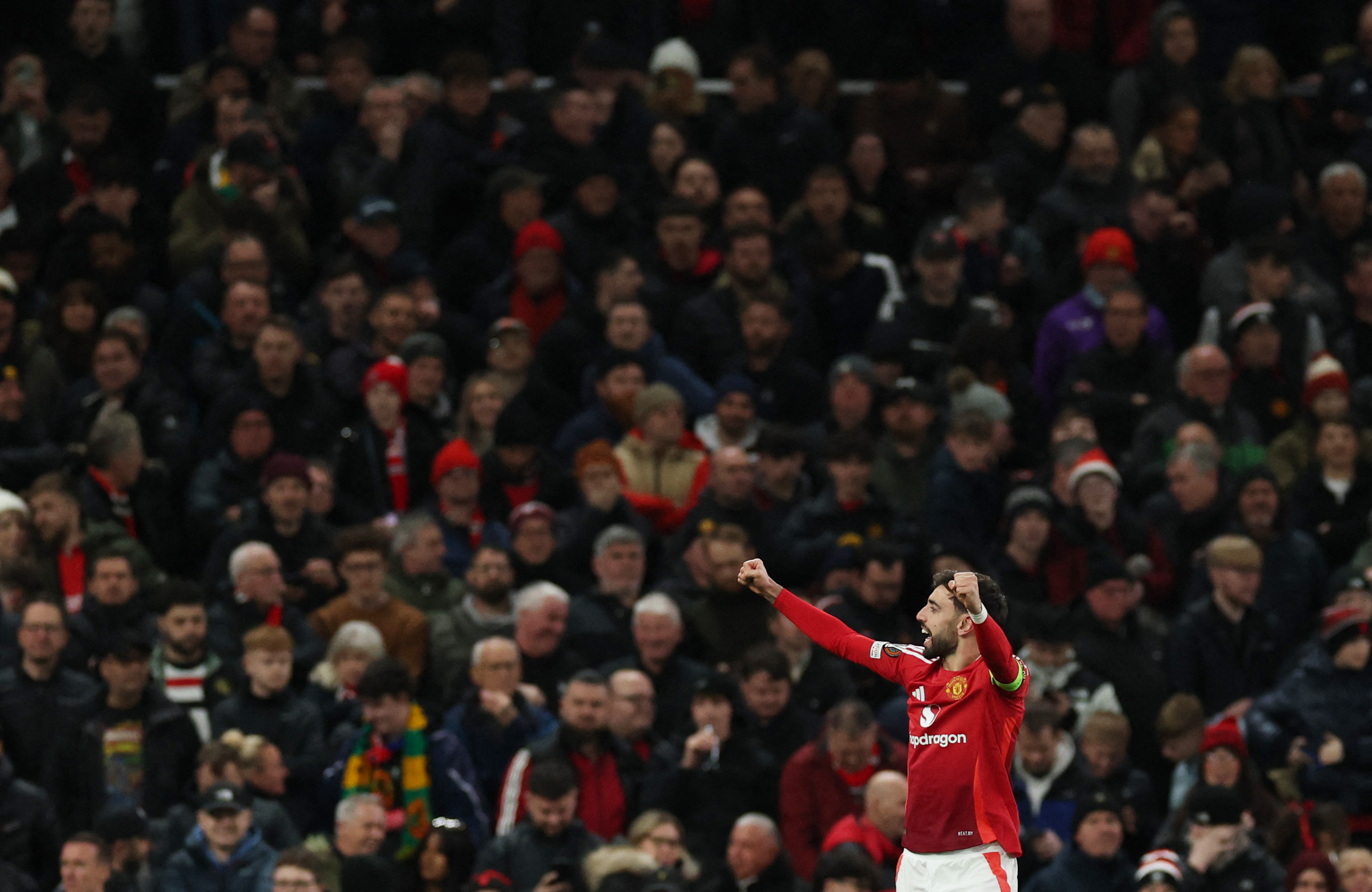 Soccer Football - Europa League - Round of 16 - Second Leg - Manchester United v Real Sociedad - Old Trafford, Manchester, Britain - March 13, 2025 Manchester United's Bruno Fernandes celebrates scoring their second goal REUTERS/Phil Noble