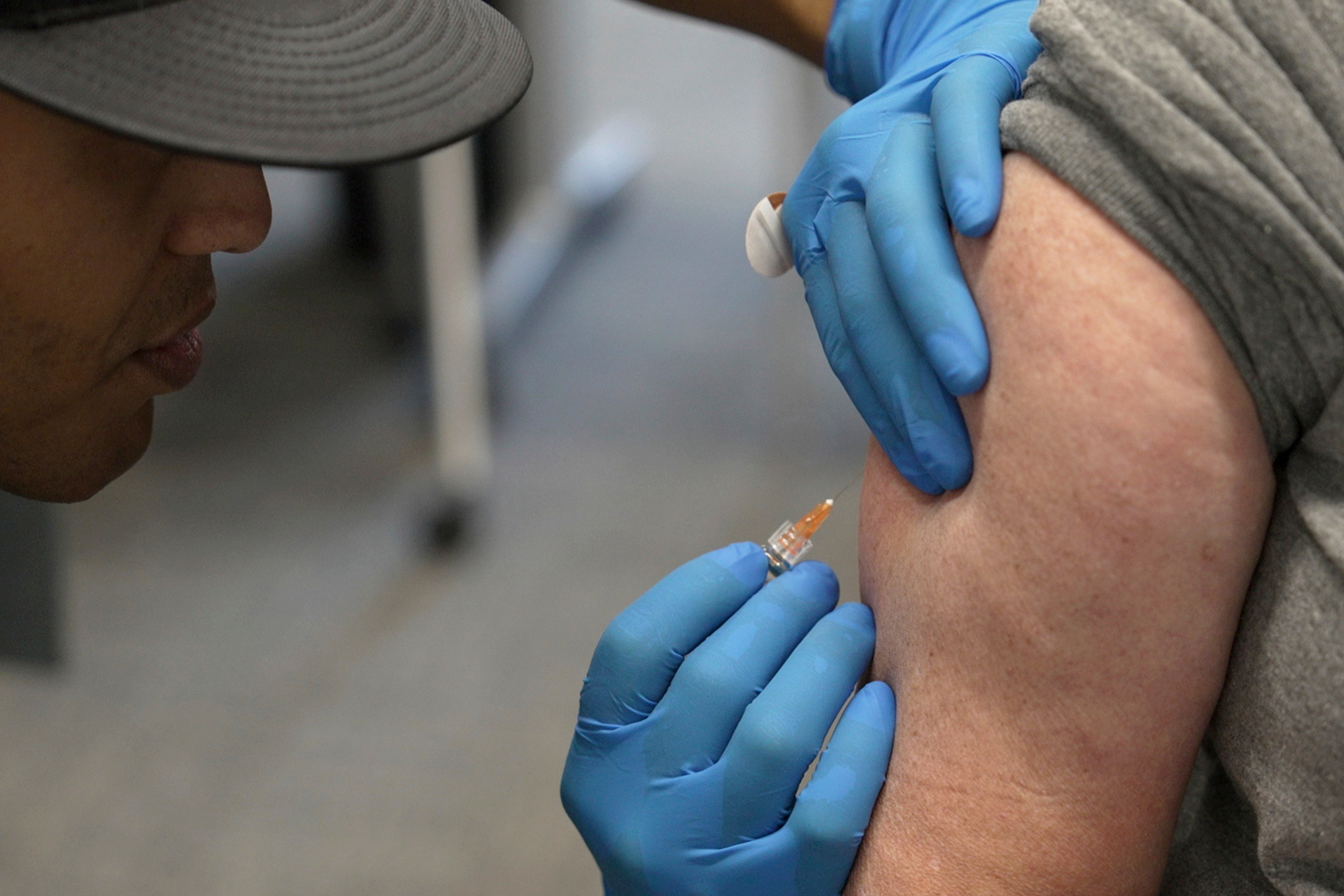A patient receives a measles shot