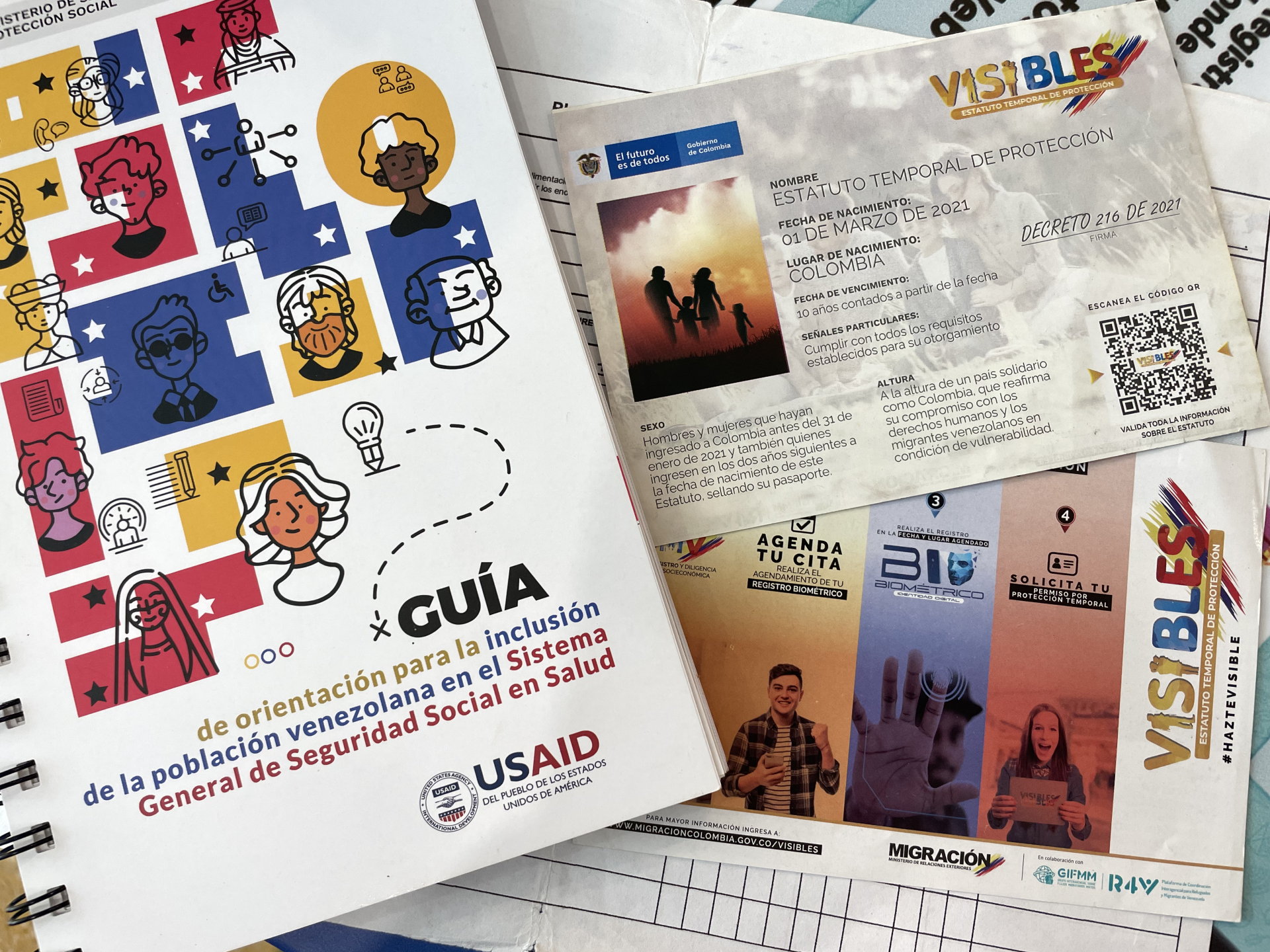 Government pamphlets distributed to Venezuelan migrants, stamped with the USAID logo.