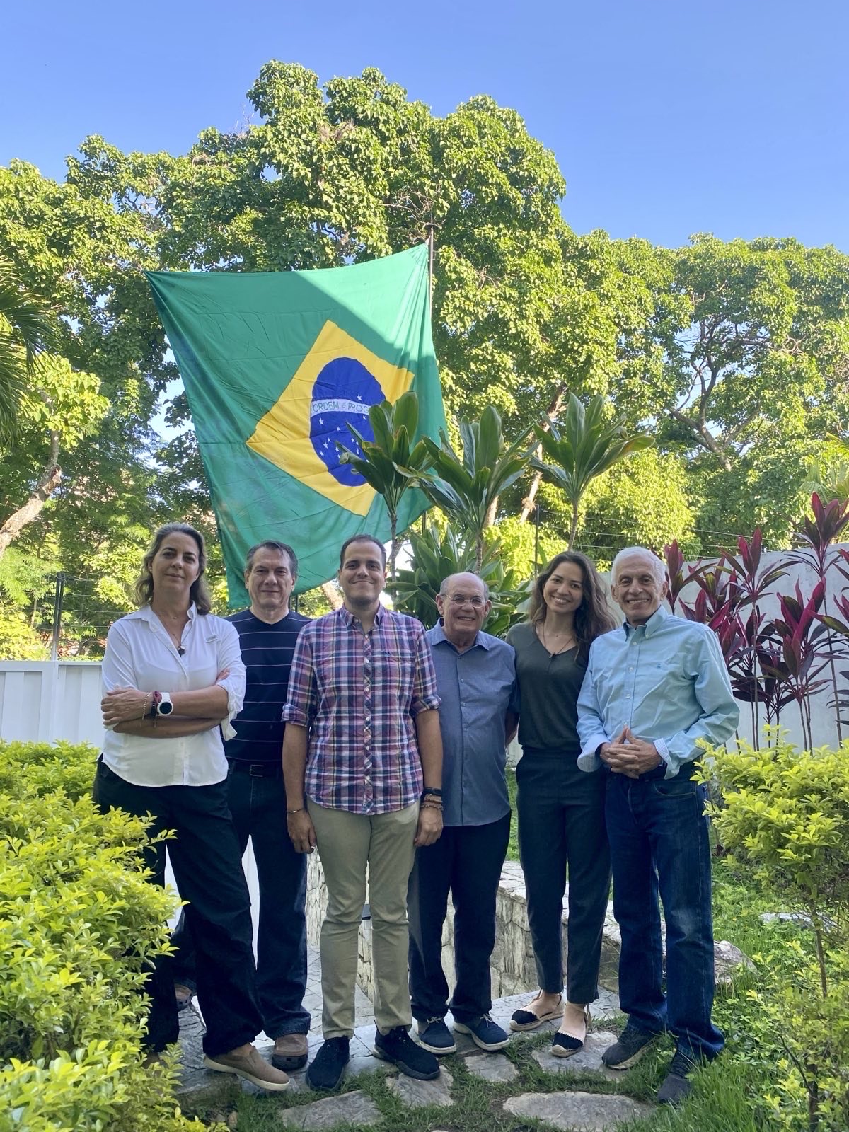 Pedro Urruchurtu, Omar González, Humberto Villalobos, Magalli Meda, Fernando Martínez Mottola and Claudia Macero pose under a Brazilian flag