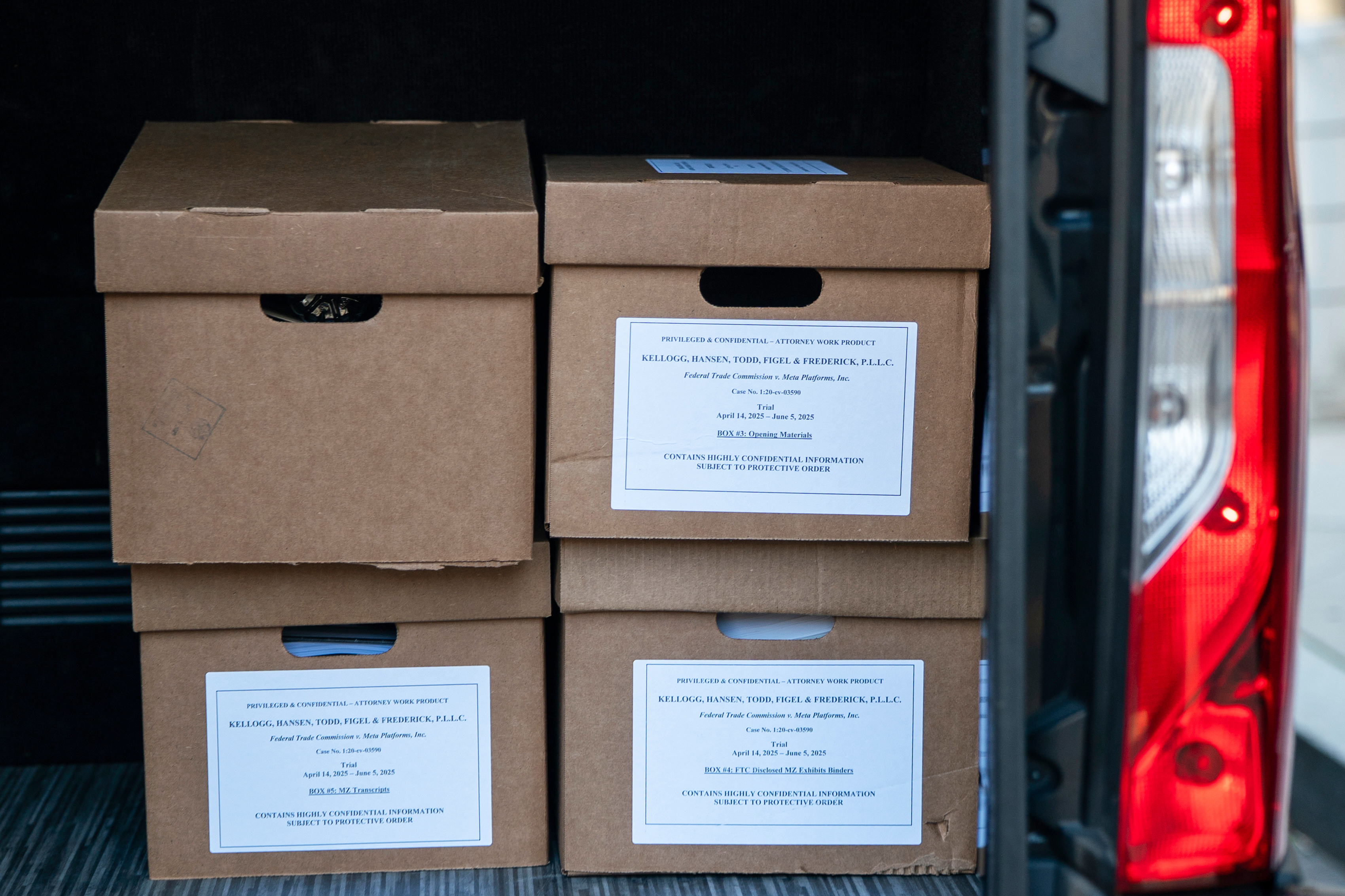 Boxes of documents are seen inside a vehicle following the first day of a historic antitrust trial about Meta CEO Mark Zuckerberg's intentions in acquiring Instagram, at Barrett Prettyman United States Court House in Washington, Monday, April 14, 2025. (AP Photo/Nathan Howard)