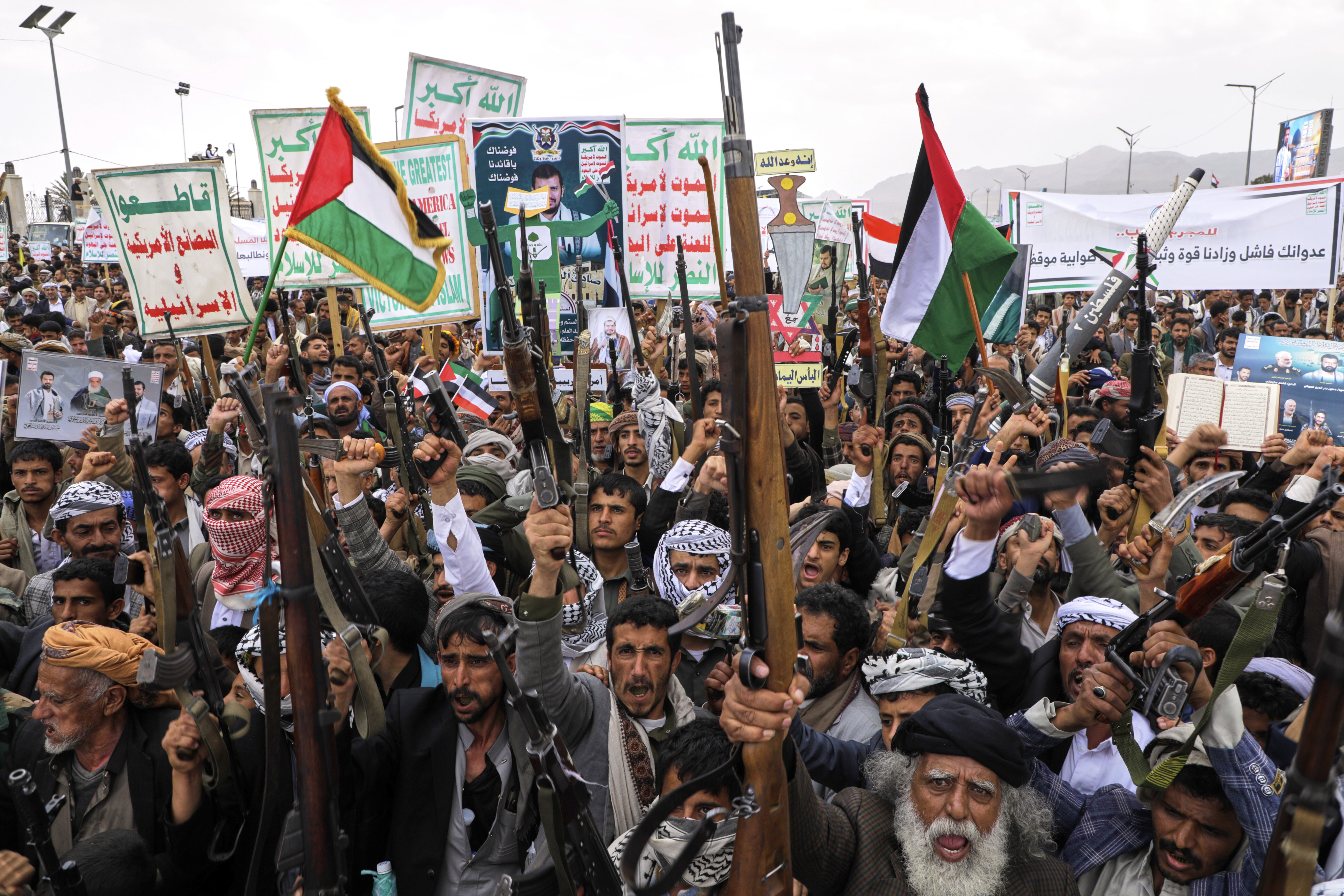 Houthi supporters chant slogans during a weekly, anti-US and anti-Israel rally in Sanaa, Yemen