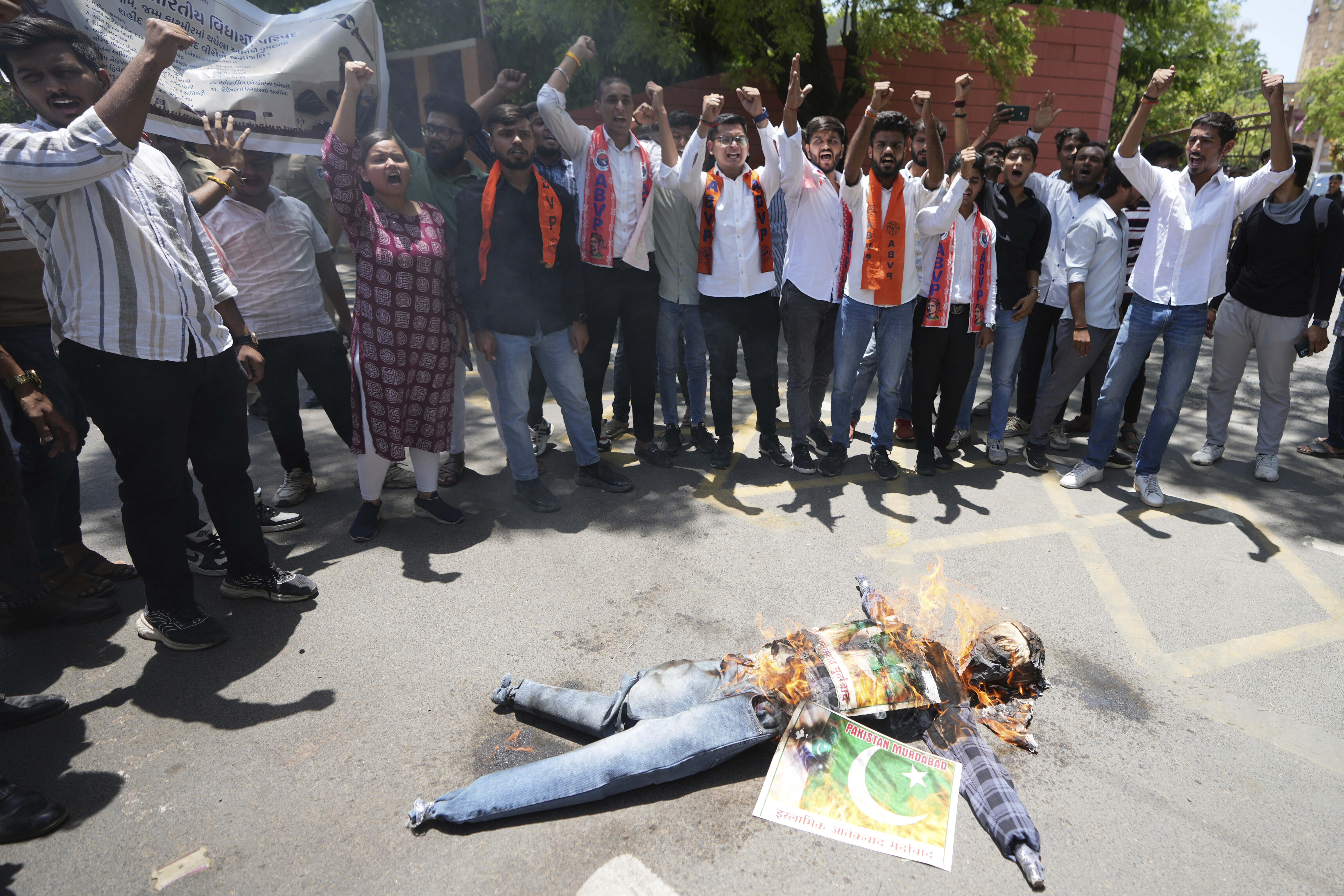Supporters of Akhil Bharatiya Vidhyarthi Parishad, or All India Students' Council burn an effigy of terrorism and shouts slogans during a protest against the killing of tourists by militants near Pahalgam in Indian controlled Kashmir, in Ahmedabad, India, Thursday, April 24, 2025. (AP Photo/Ajit Solanki)