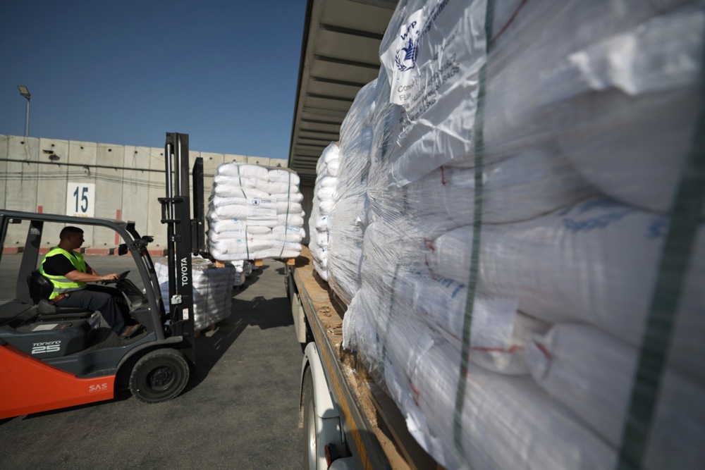 Pallets of food items are loaded onto a truck as they wait to enter the Gaza Strip at the Kerem Shalom crossing, in southern Israel, 22 May 2025. According to the UN half a million people, or one in five people in the Strip are facing starvation while the entire population of the Gaza Strip continues to face a critical risk of famine following 19 months of conflict, mass displacement and severe restrictions on humanitarian aid. EPA-EFE/ATEF SAFADI