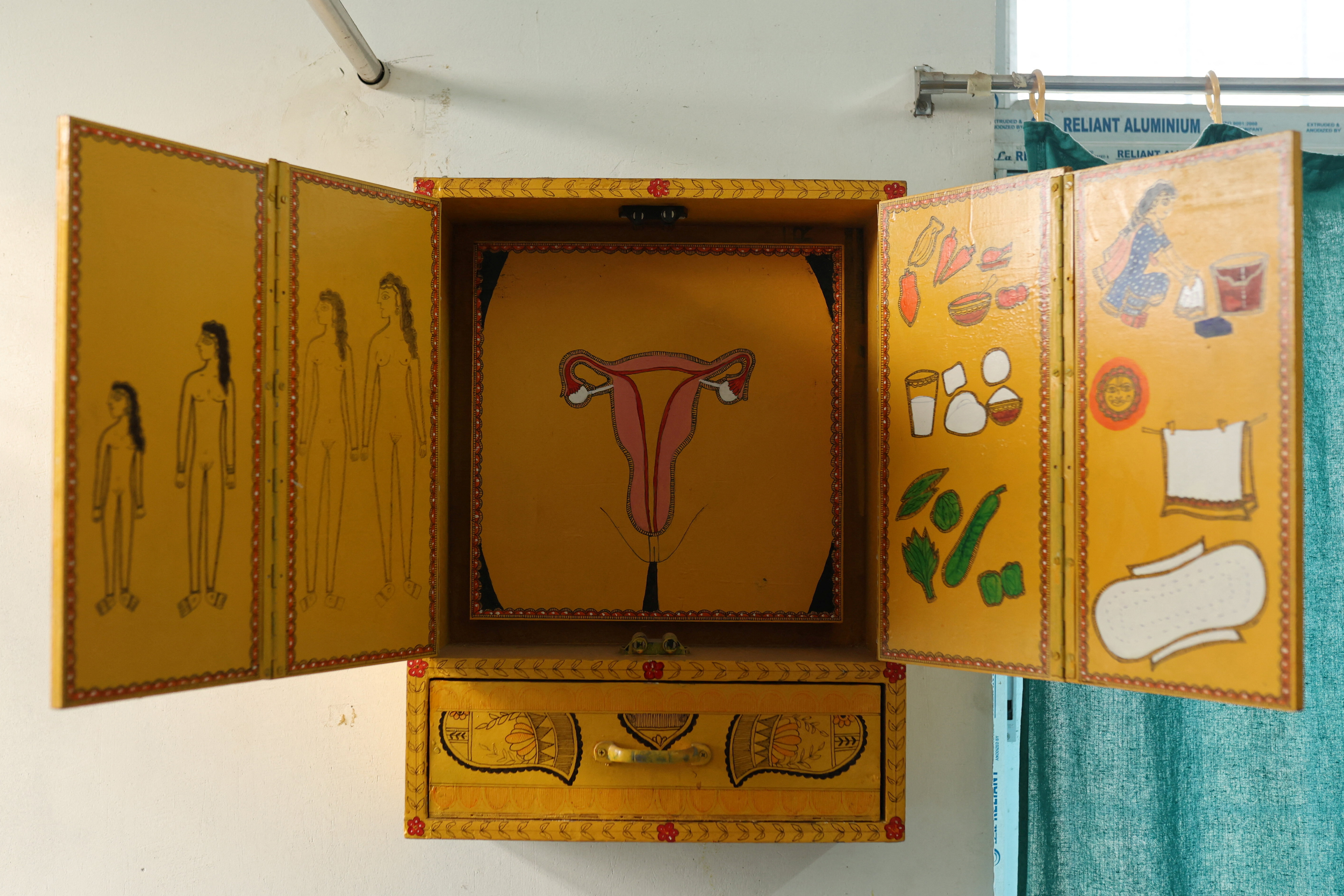 A wooden board used to explain menstruation and the female anatomy is seen inside the counseling office of a community health centre in Bahadurganj subdivision of Kishanganj district, Bihar, India, March 21, 2023. India’s fertility rate, fell to 2.0 in 2019-21, but State health officials estimate Kishanganj's fertility rate at 4.8 or 4.9, creating a population growth problem that the state is trying to curb with the distribution of condoms and birth control pills, as well as the paying 3,000 Indian rupees ($36.50) to women who get sterilised, 4,000 rupees to men, and 500 rupees per surgery to the health workers who perform them. "The state government's focus is to ensure that policy interventions percolate to the ground, its mechanisms such as free sterilisation, temporary birth control instruments are used actively," said Sanjay Kumar Pansari, director in the Bihar government's Directorate of Economics and Statistics. REUTERS/Anushree Fadnavis SEARCH "FADNAVIS POPULATION" FOR THIS STORY. SEARCH "WIDER IMAGE" FOR ALL STORIES.