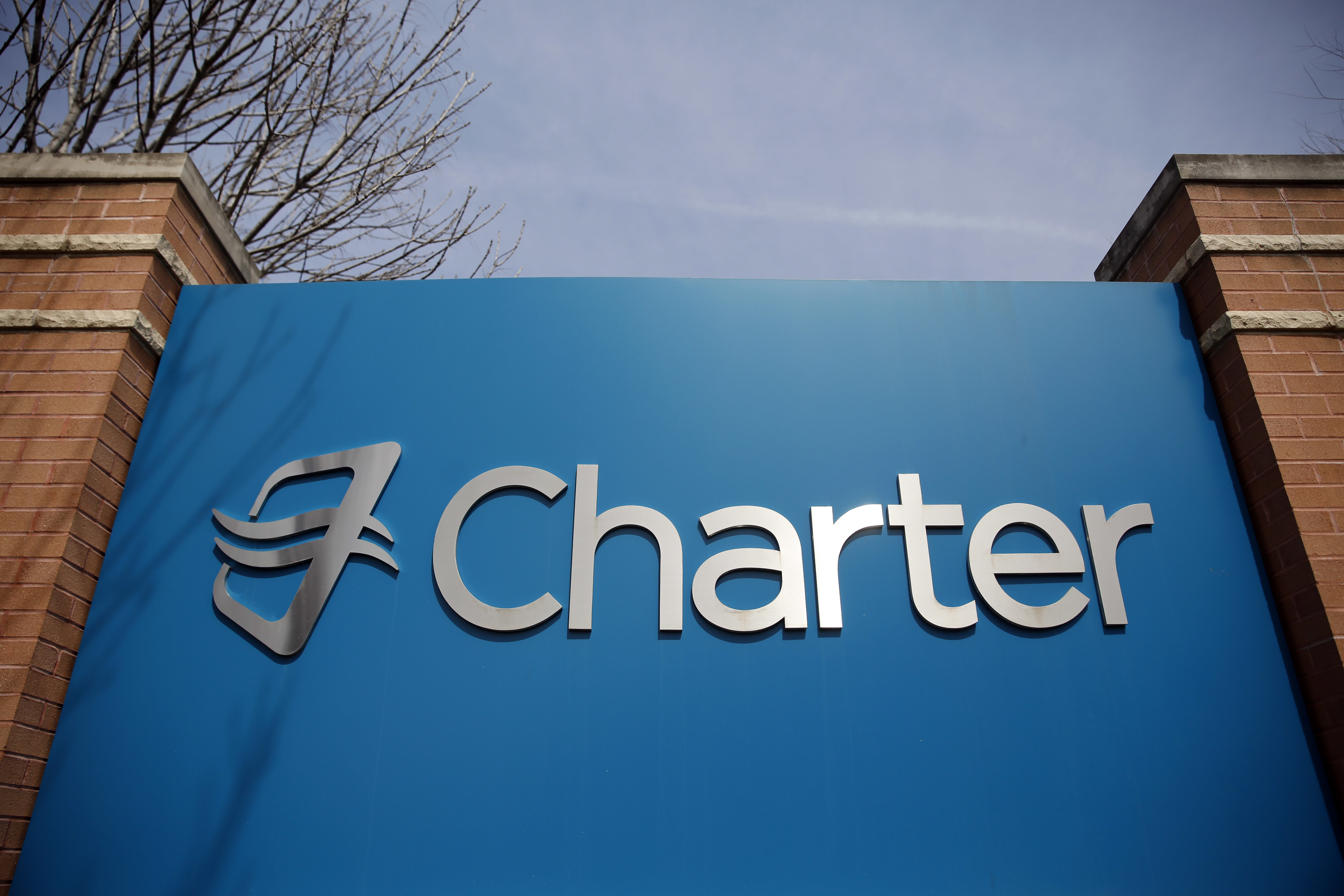 Signage at an entrance to Charter Communications' headquarters.