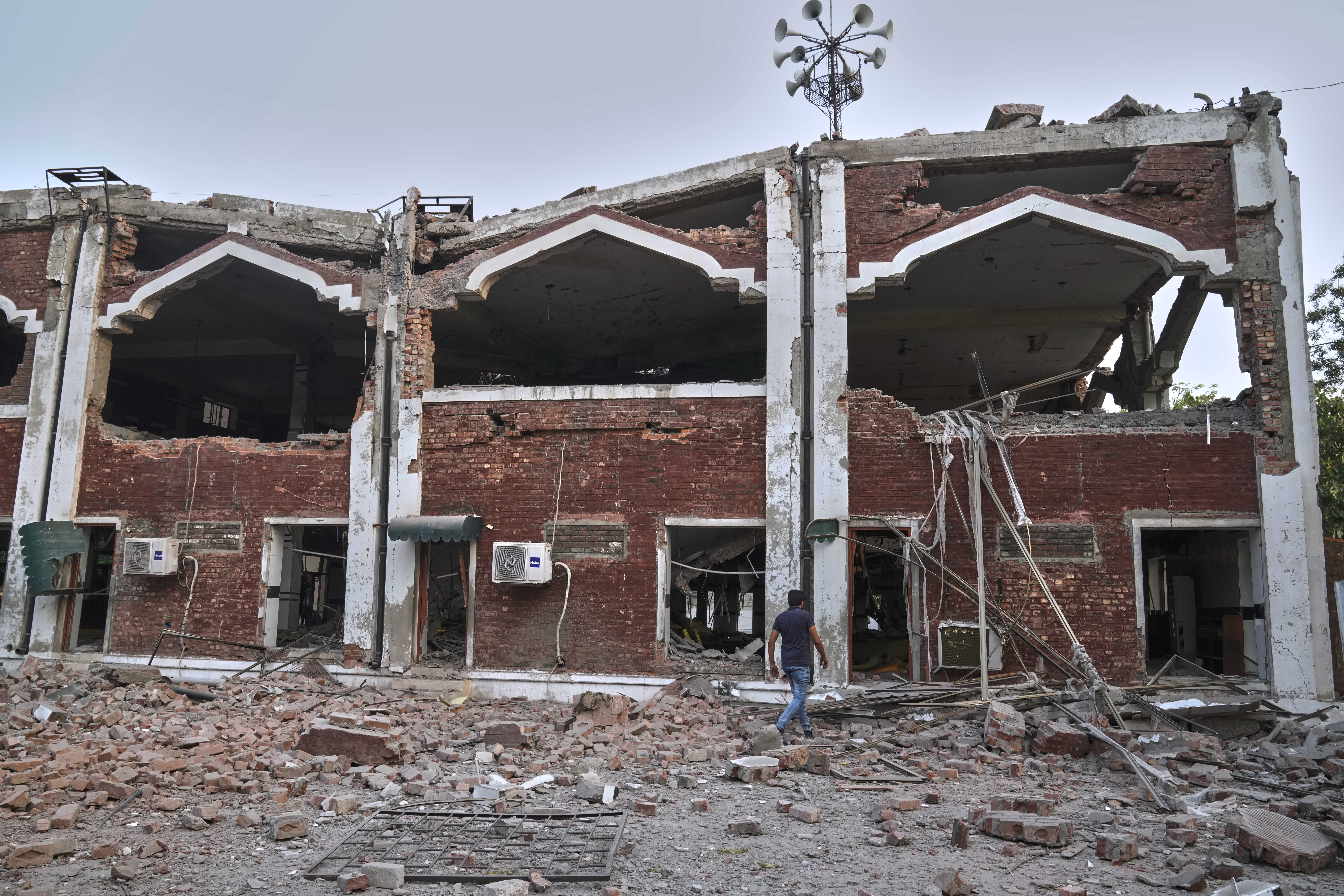 a mosque building damaged by Indian missile attack, in Muridke, a town in Pakistan's Punjab province, Wednesday, May 7, 2025. (AP Photo/K.M. Chaudary)