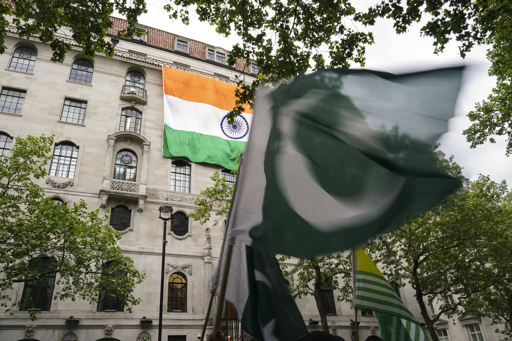 Demonstrators wave flags as they gather to protest outside the India High Commission, in London, Wednesday, May 7, 2025.(AP Photo/Alberto Pezzali)