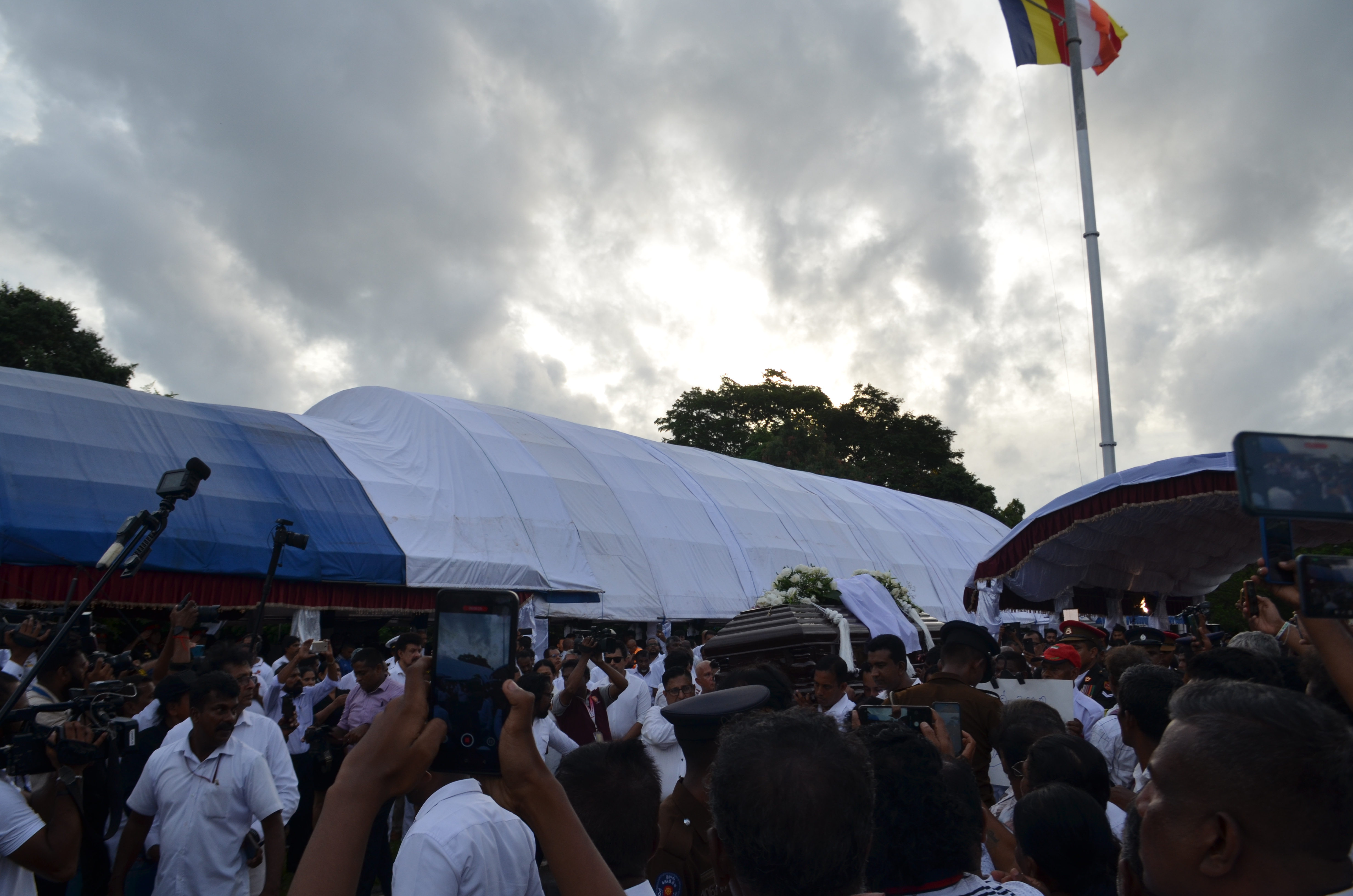 People carrying Fonseka's coffin to a specially erected cremation tower at Colombo’s Independence Square on Monday, May 25, 2025 [Jeevan Ravindran/Al Jazeera] 