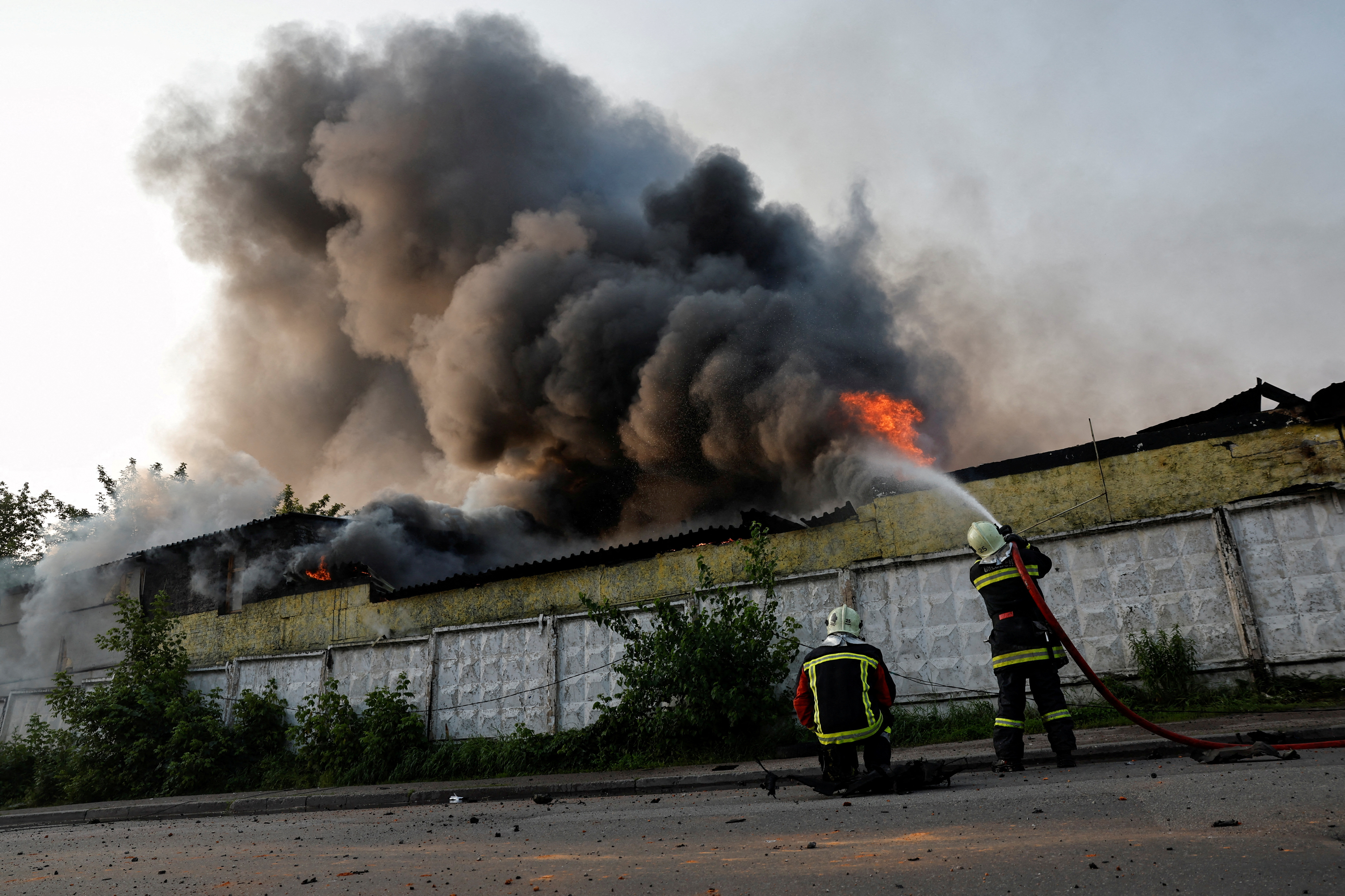 Firefighters work at the site of a Russian drone strike, amid Russia's attack on Ukraine, in Kyiv, Ukraine June 10, 2025. REUTERS/Thomas Peter TPX IMAGES OF THE DAY
