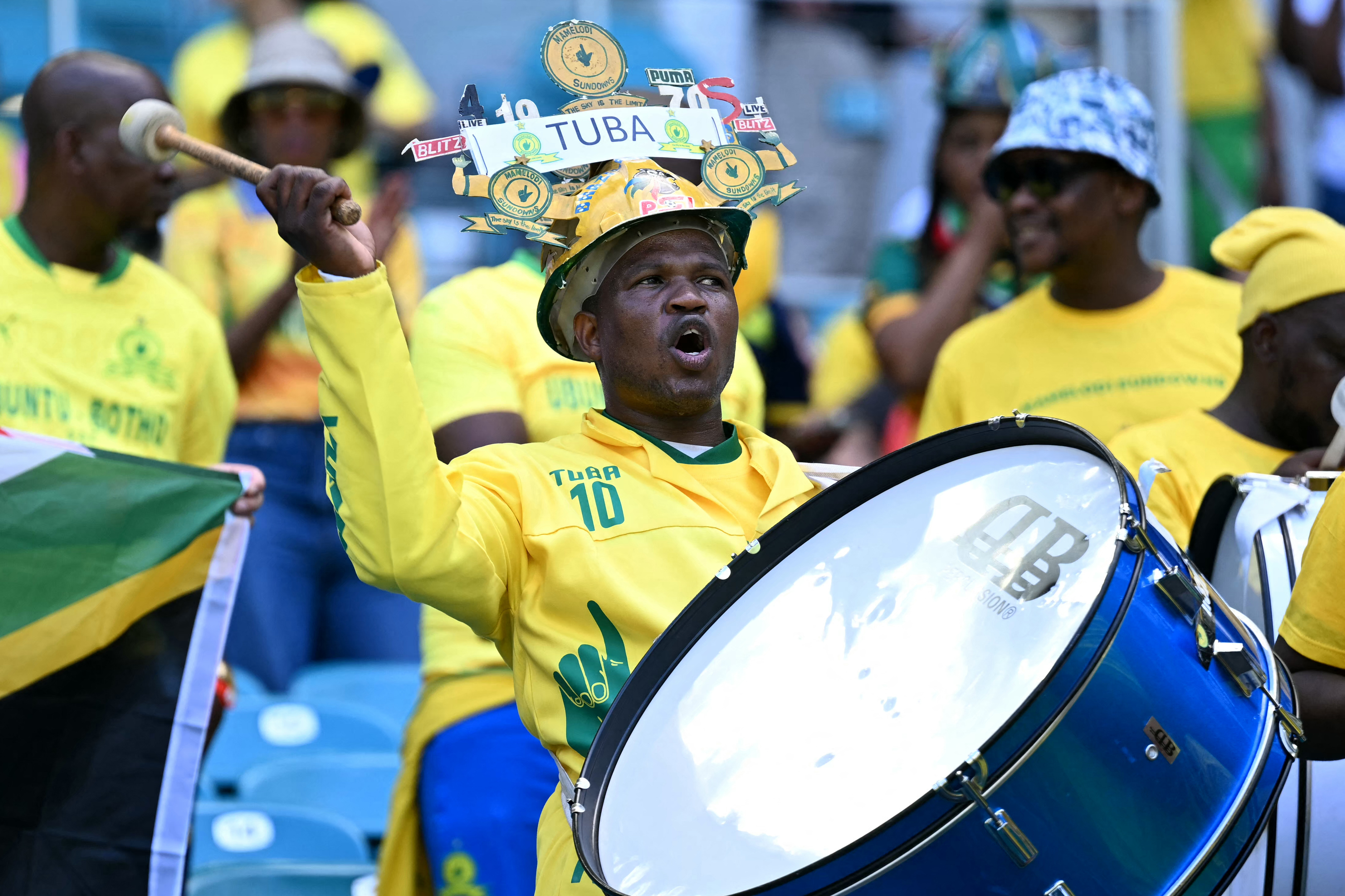 A fan of Mamelodi Sundowns cheers for his team ahead of the FIFA Club World Cup 2025 Group F football match between South Africa's Mamelodi Sundowns and Brazil's Fluminense at the Hard Rock stadium in Miami on June 25, 2025. (Photo by Chandan Khanna / AFP)