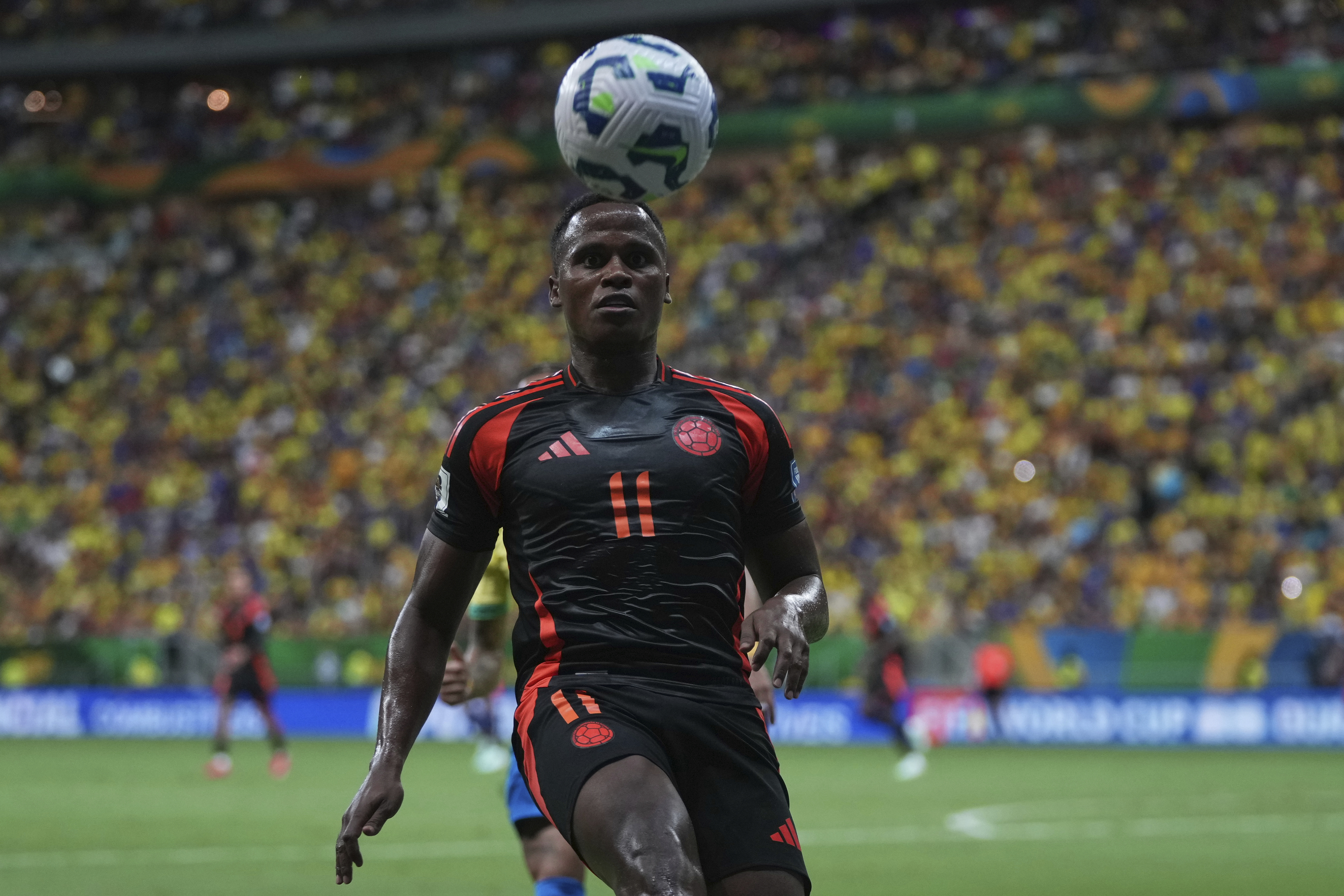 Colombia's Jhon Arias eyes the ball during a FIFA World Cup 2026 qualifying soccer match against Brazil at Mane Garrincha stadium in Brasilia, Brazil, Thursday, March 20, 2025. (AP Photo/Silvia Izquierdo)