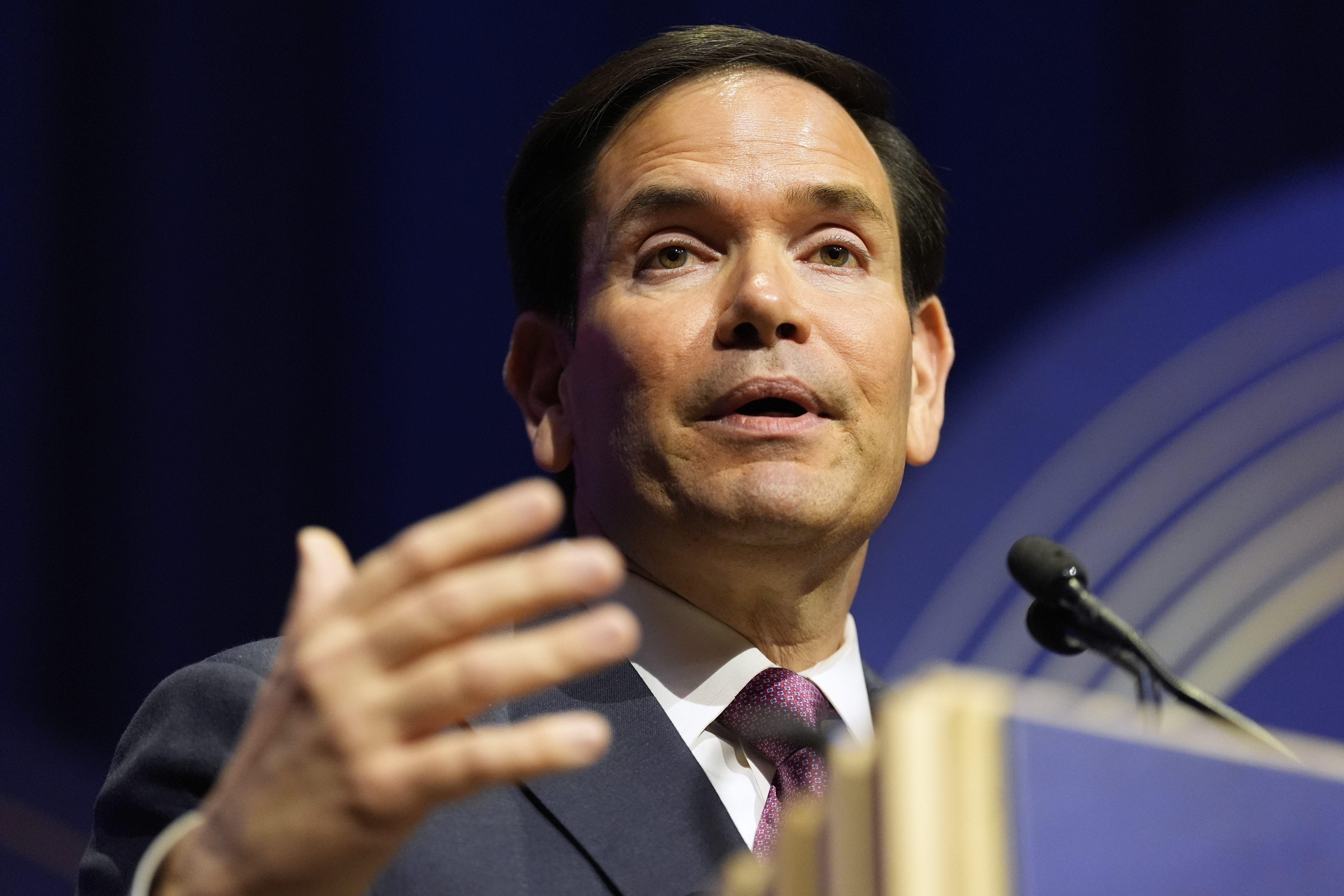 Marco Rubio speaks at a podium.