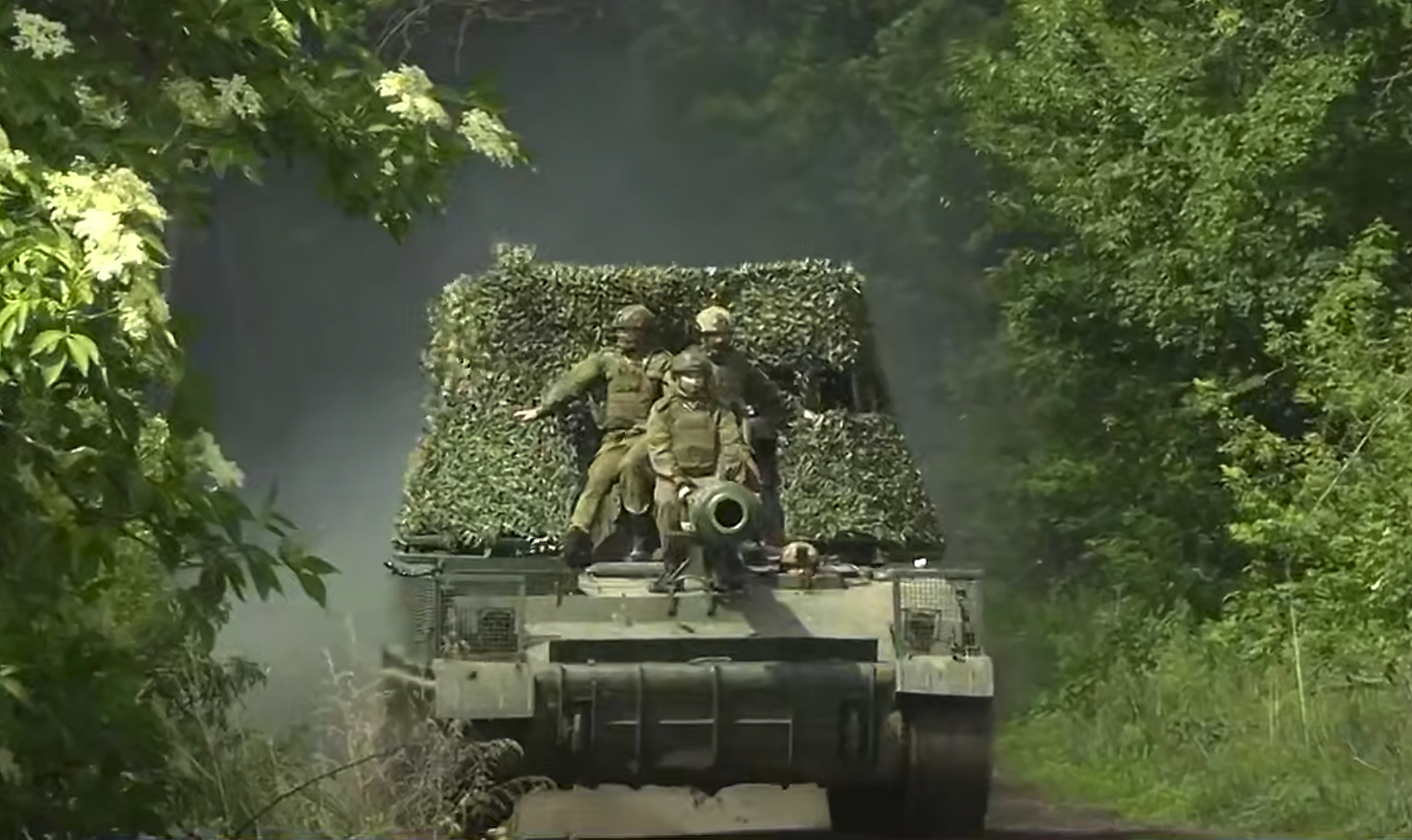 In this photo, taken from video released by Russian Defense Ministry Press Service on Monday, June 9, 2025, Russian soldiers ride an Akatsyia self-propelled gun on an undisclosed location in Ukraine. (Russian Defense Ministry Press Service via AP)