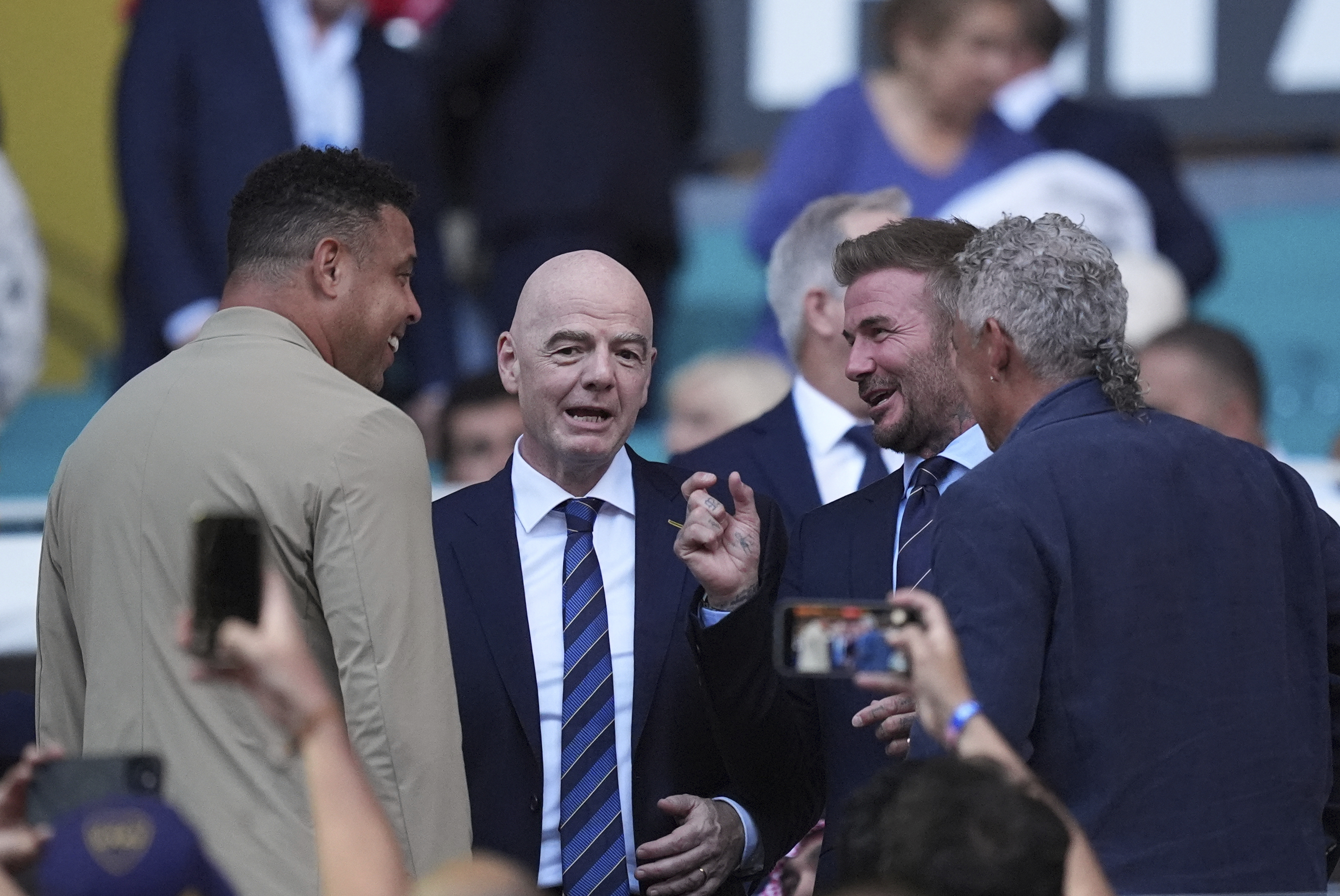 From left, Brazilian former soccer player Ronaldo, FIFA president Gianni Infantino, and Inter Miami co-owner David Beckham talk prior to the Club World Cup group A soccer match between Al Ahly and Inter Miami in Miami, Fla., Saturday, June 14, 2025. (AP Photo/Rebecca Blackwell)