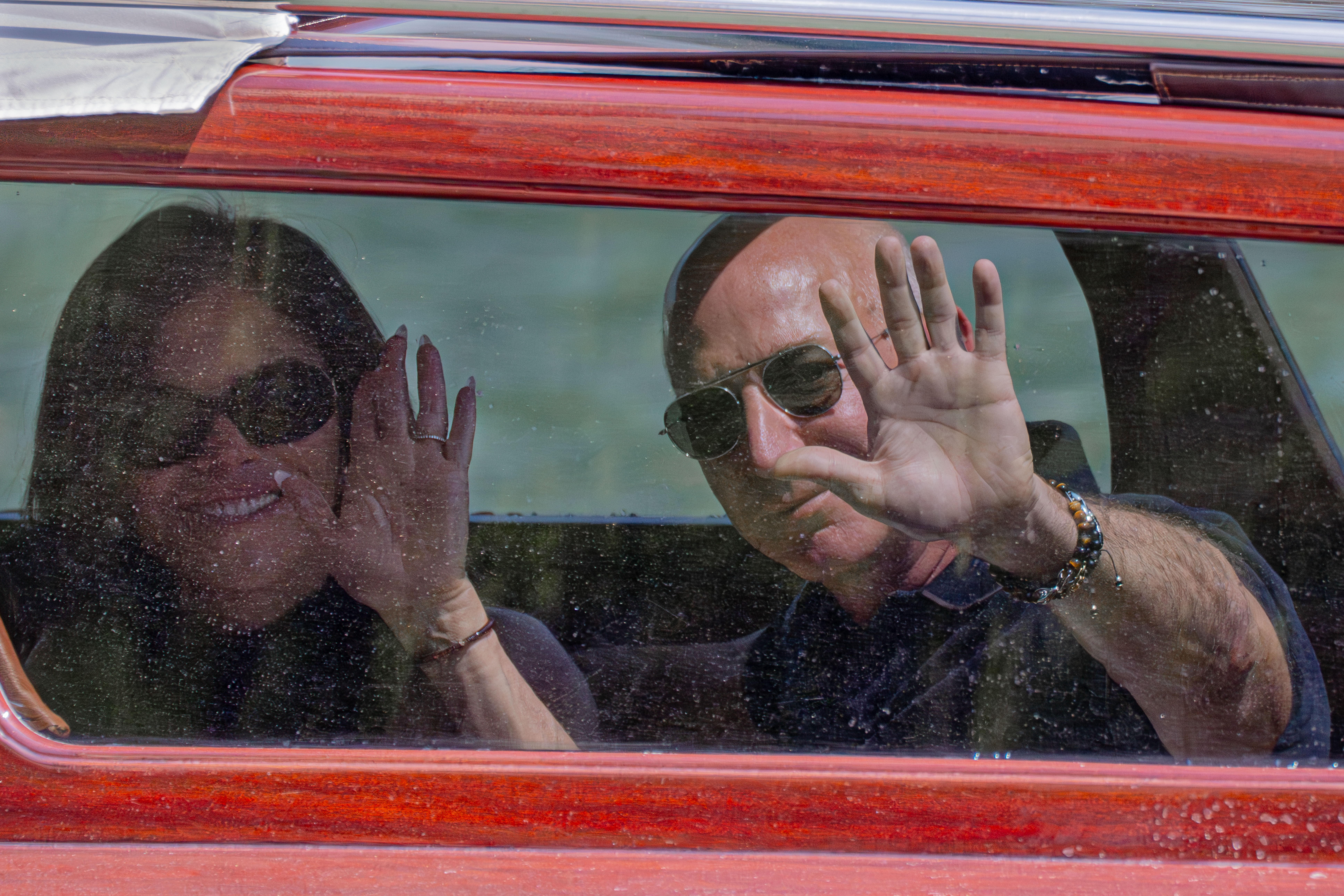 Amazon multi-billionaire founder Jeff Bezos, right, and Lauren Sanchez arrive by boat at a hotel in Venice, Italy, on Wednesday, June 25, 2025, ahead of festivities in the lagoon city reportedly linked to their wedding. (AP Photo/Luca Bruno)