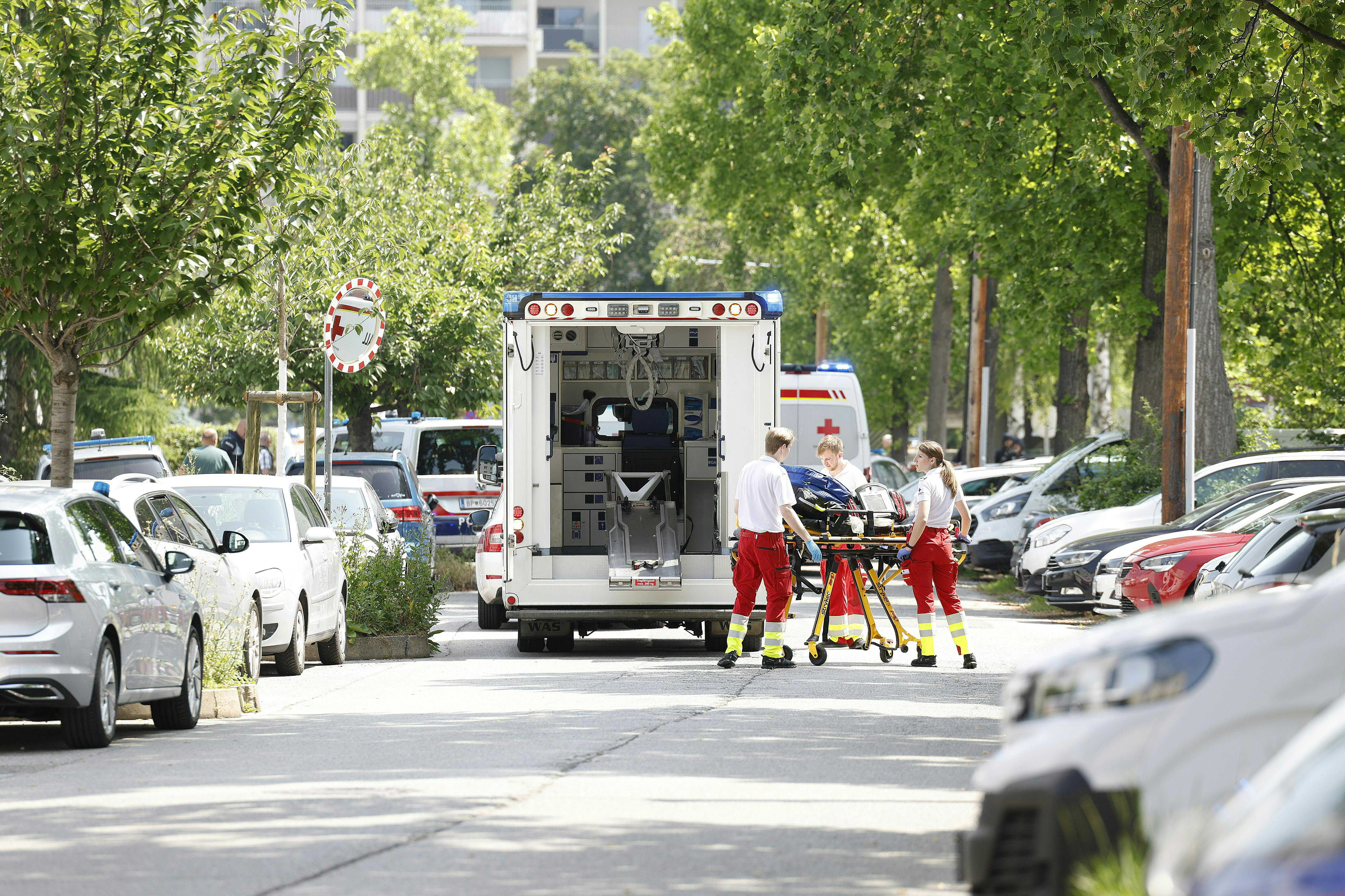 Rescue paramedics are seen next to an ambulance car close to a school where, according to reports, several people died in a shooting, on June 10, 2025 in Graz, southeastern Austria.